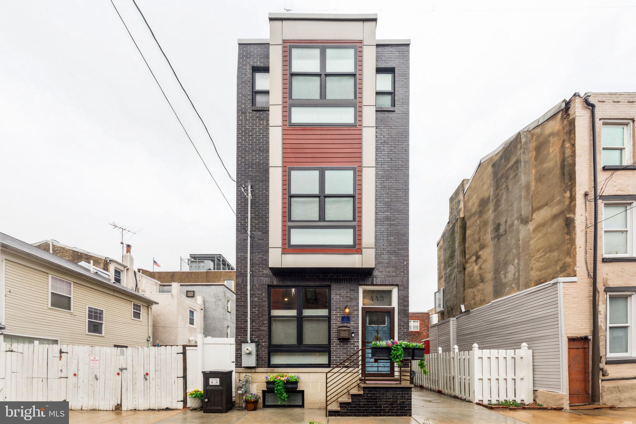 Come and see yourself in this custom built, 5 years young, rare stand alone row with parking for one car in South Philly! As you walk through this sprawling and spacious, complete with 11ft ceilings and 9ft wood panel doors, you will notice custom built features throughout this one of a kind home. The front has a cozy sitting area for family. Take a look at the bespoke farmhouse island, range and pantry, with custom shelving. Coffee & tea bar with built in microwave with LG appliances. Farmhouse sink with never ending hot water tap. Unique German smear brick is the backdrop of your kitchen while cooking. Lower level includes study and workout area with custom tile around fixtures & full bath (possible 4th bedroom). Utility room which includes some shelving for storage. Middle level includes 2 spacious guest bedrooms with custom windows & wood molding. Also, to include one full bath with custom tile finishes around sink & toilet. Stackable LG washer & dryer with custom built shelves for storage. Primary bedroom with full bath on top floor includes custom tile around fixtures and flooring along with custom shower with overhead shower option, all with a farmhouse flair. Pex lines for plumbing which means never ending hot water showers. Roof deck includes tailor made cedar pergola with Sunbrella fabric weaved in for shade. Epoxy flooring for protection and to provide low maintenance cleaning and includes storage for cushions. Back of the house includes a separate storage shed for all your tools or holiday decorations! All this with a 5 year tax abatement.
