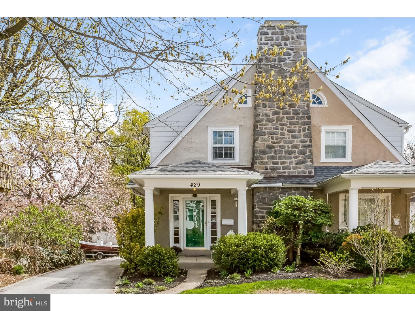 Sophisticated and Enchanting this all stone spacious twin delivers great space and inspirational views. Meticulously maintained and freshly painted. Gleaming hardwood floors. Sun washed Living Room features stone fireplace and stunning bookcases. Big beautiful Dining Room flooded with natural light. Efficient well equipped eat in Kitchen. Perfect Office Nook and access to Deck and Grounds. Second floor has 3 roomy Bedrooms and a windowed Bath. Closets galore! Third floor walk up Attic perfect for future expansion. The finished Lower Level adds 200 sq ft of living space with fitted closet, glass block and lovely Powder Room. Huge Laundry with outside access. Your long PRIVATE Driveway, detached Garage,and enclosed Backyard with professionally landscaped gardens make this home truly a perfect choice. Tucked away yet in WALKING distance to the train, fine dining, upscale shopping, and Houses of Worship. Near Universities and Hospitals and in the renowned Lower Merion School district.