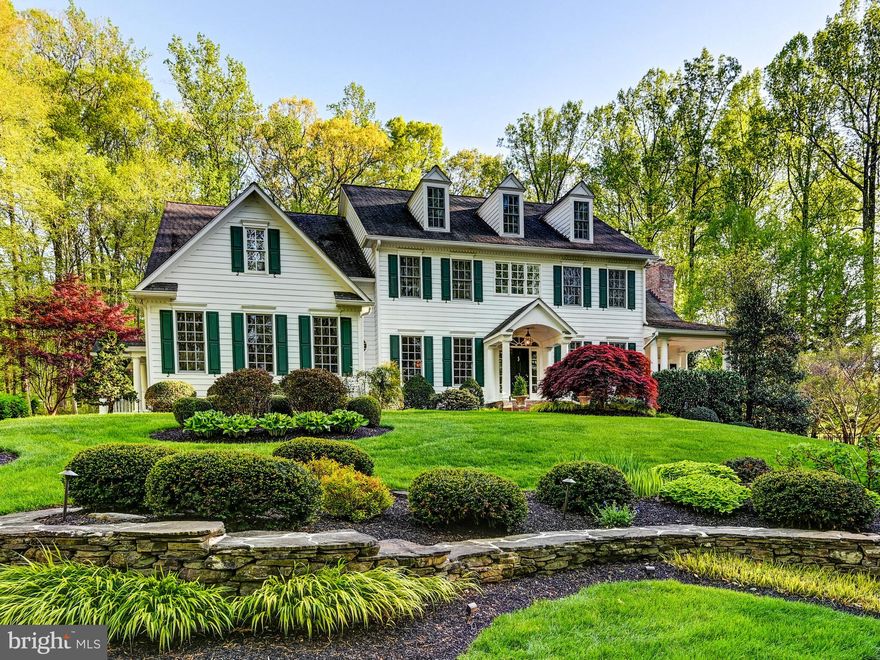 Spacious and distinctive colonial home located in the wonderful Wesley Chapel Woods community in Monkton. Nestled on over 1 acre of pristine landscape, providing privacy and a serene setting. The property is set amongst the woods enhancing the seclusion and natural beauty while still being in the midst of a neighborhood. This classic architectural style is synonymous with symmetry and specific design elements that are not to be disappointed. Interior highlights comprise of the formal entryway flanked by living and dining rooms, Florida room and office with private porches, sunken family room and numerous fireplaces adding warmth and charm to the various rooms. Open, eat-in kitchen with large island and additional table space makes for a perfect gathering spot for family meals and entertaining. The mudroom conveniently located off the kitchen leads to an attached 3 car garage with side entrance for extra ease. Split staircase to the upstairs offers practicality for all. Offering 6 bedrooms and numerous bathrooms including an incredible primary suite and separate office/sitting area plus 3rd floor bonus play area perfect for family flexibility. The lower level features a recreation room ideal for all fitness needs, crafting, and an extra family room exiting to the outdoor tiered side and backyards. The fabulous deck overlooks the maintained gardens and plantings, creating a retreat-like atmosphere perfect for relaxation or hosting of events. The beautifully designed custom saltwater swimming pool with stone fountain is built for the most particular of pool enthusiasts in an unbeatable setting. Hot tub and the fire pit are a definite hit too! All of this meant for enjoyment throughout all the seasons to come all the while accomodating different lifestyle needs with abundant indoor and outdoor spaces. Finally but not least, let's not forget to take advantage of everything Monkton has to offer in its schools, culture, recreation, accessibility and much more.