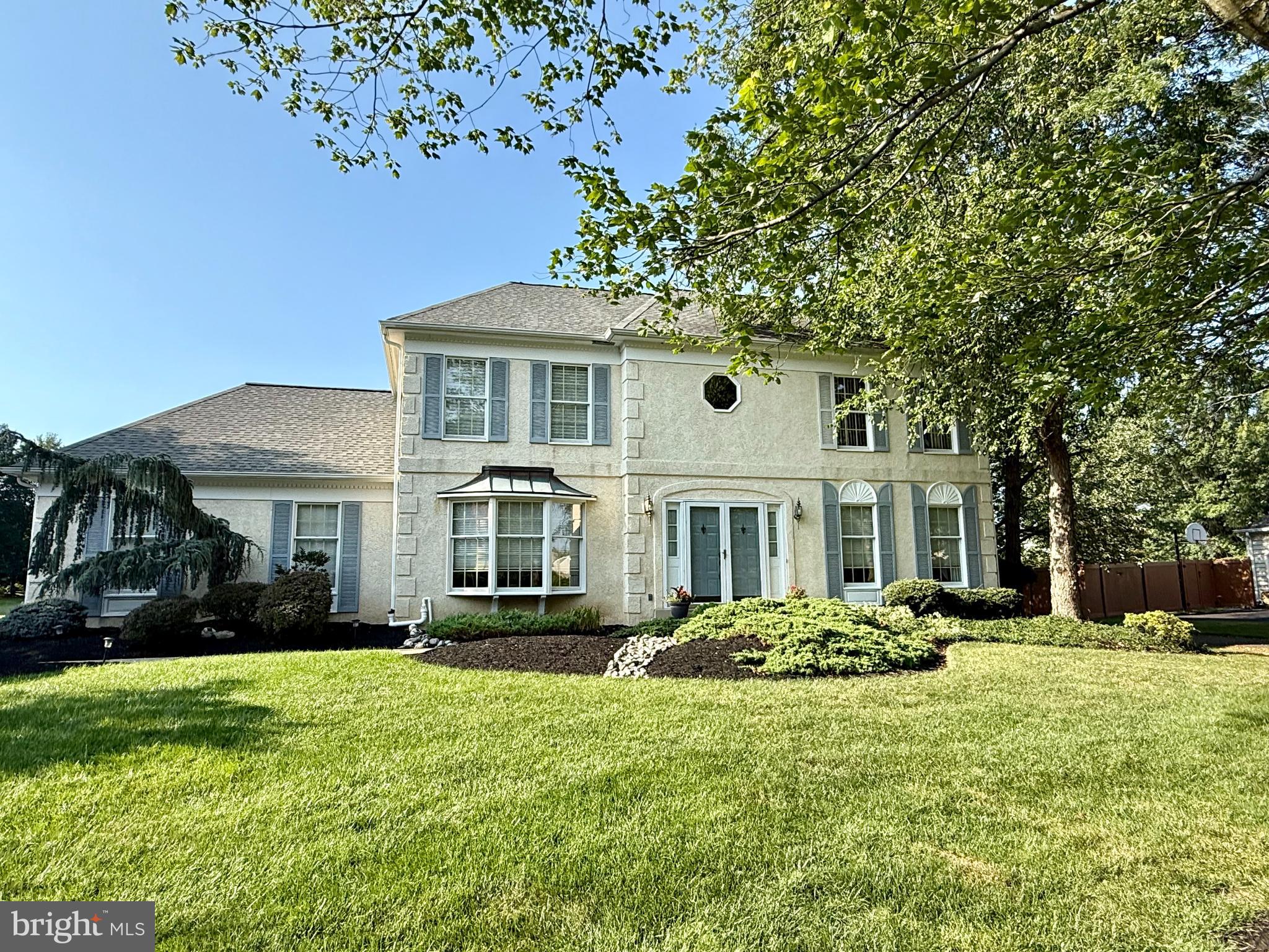 Welcome to this beautifully maintained 4-bedroom, 2.5-bath colonial in the highly desirable Hampton Chase neighborhood of Jamison, located within the award-winning Central Bucks School District. A professionally landscaped front yard sets the tone as you step inside to find a formal living room with French doors leading into the inviting family room, complete with a wood-burning fireplace, custom built-ins, and a wet bar. The family room opens fully to an expansive eat-in kitchen featuring high-end appliances, custom cabinetry, granite countertops, a breakfast bar for four, and a spacious dining area with sliders to the deck. Outside, enjoy a stunning backyard retreat with a large deck overlooking the expansive, beautifully maintained grounds and tranquil neighborhood walking trail. A formal dining room, powder room, and laundry room with direct access to a 3-car garage with brand new doors complete the main level. Upstairs, the luxurious primary suite offers a professionally organized walk-in closet and an en suite bath with dual sinks, a jetted tub, and oversized shower. Three additional generously-sized bedrooms, each with its own professionally organized closet, and a full hall bath round out the upper level. The fully finished basement expands the living space with a large recreation room, private office, home gym, storage closet, cedar closet, and utility room.