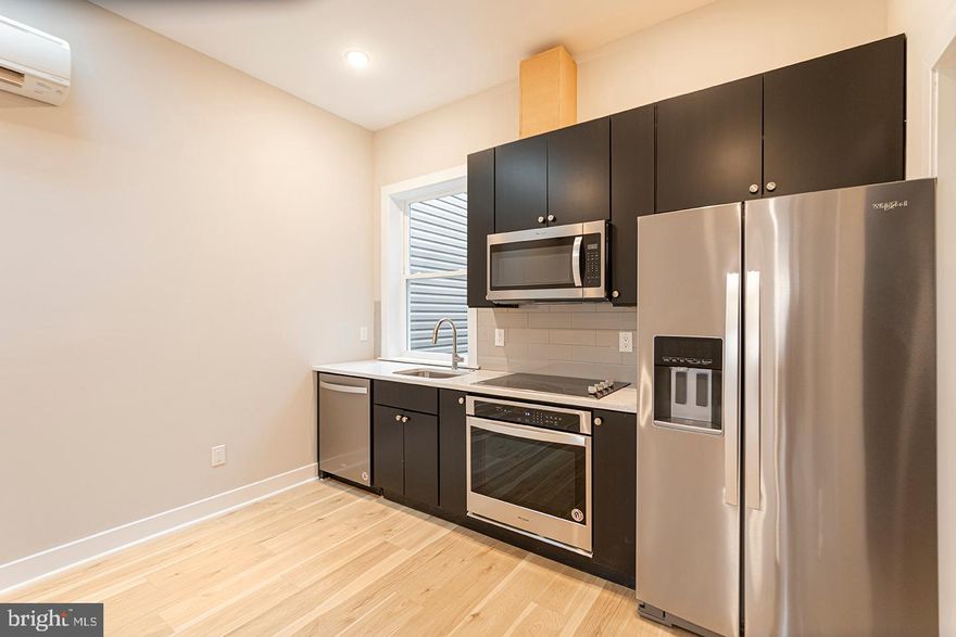 *NOW WELCOMING IN-PERSON TOURS!! - MASKS REQUIRED*  This brand new beautiful, spacious and modern 1 bedroom, 1 bathroom apartment is sure to impress with hardwood floors, a modern kitchen with sleek black cabinets and stainless steel appliances that include a dishwasher, microwave, garbage disposal, an electric oven/stove and refrigerator. The bedroom boasts a huge closet space and large windows are found to provide an abundance of sunshine. The bathroom also hosts a beautiful black tile shower with glass doors and a washer and dryer are located in unit. Lastly, a private roof deck which has amazing city skyline views is a perfect place to host BBQ's in the summer or take in the sun with a warm coffee or tea in fall.   *Dogs permitted under 25 pounds or one cat* *$500 Pet Deposit*  Please call to schedule an appointment for a showing!
