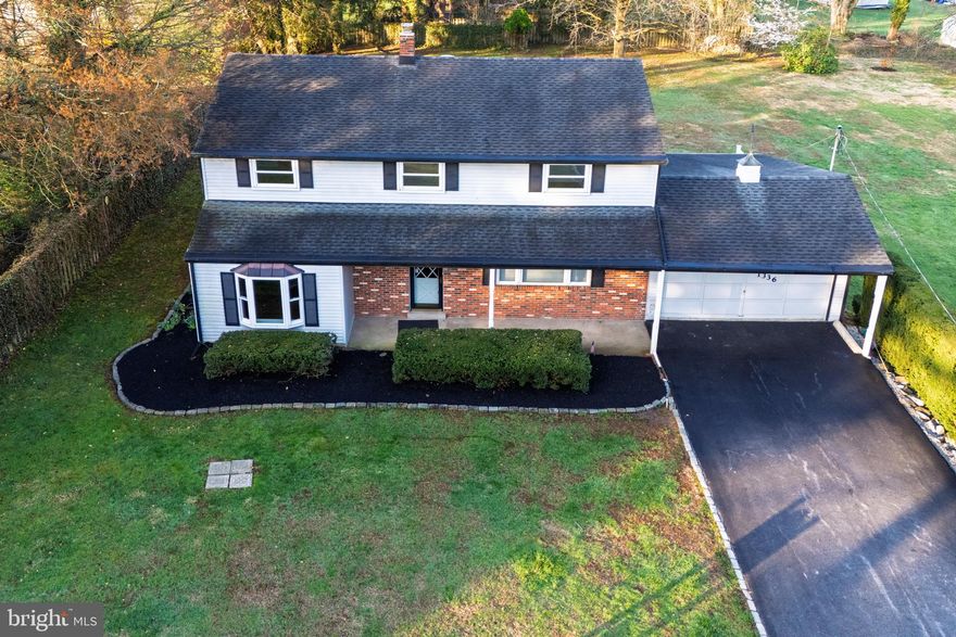 What a lovely home, with classic Colonial architecture and an absolutely sweeping backyard. 1336 Ship Rd offers pristine exterior curb appeal with a covered front porch, manicured landscaping, and a backdrop of mature evergreen trees. Inside, this home enjoys a circular floorplan with a seamless flow between living spaces. Light-filled, spacious rooms include formal living and dining and an expansive family room, all anchored by the central kitchen and breakfast room. There are built-ins and half walls, with hardwood flooring throughout most of the main level, and the entire floorplan offers a welcoming sense of space for gatherings or relaxation. At the back of the home, the southwest-facing sunroom will warm your afternoons while providing stepdown access to the flagstone patio and the large backyard. If you’re dreaming of games of catch, summer BBQs, frisbee, and a space for Fido to play, be sure to explore this backyard! Upstairs, there are 5 bedrooms, all with hardwood flooring, as well as 2 full bathrooms, including an en suite private bath in the owner’s retreat. This home also has an unfinished basement that offers excellent storage. Located on Ship Rd between King Rd and Phoenixville Pike, you’ll enjoy no-fuss access to local amenities, shops, and dining in both Exton and West Chester, with major commuter routes including Rte 202 near at hand. What a classic floorplan in a convenient location! Request a personal tour today.