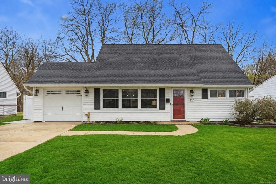 Welcome to 157 Mill Drive, an extensively upgraded and thoughtfully redesigned 4-bedroom, 2.5-bath home where custom craftsmanship, modern design, and flexible living come together.
As you enter, you’re immediately greeted by a layout that sets this home apart. Instead of the expected flow, the primary suite is privately tucked just behind the front door. This spacious retreat features a striking accent wall, built-in remote-control fireplace, and a beautifully designed walk-in closet with custom shelving and organization. The en-suite bathroom showcases a double vanity with marble-style countertops, sleek black fixtures, and a fully tiled walk-in shower with glass enclosure, offer a true spa-like experience.
Moving into the main living space, the open-concept design unfolds into a warm and inviting living room centered around a second remote-control fireplace, custom built-ins, and a designer wood accent wall. Wide plank flooring, recessed lighting, and clean modern lines carry throughout the home.
The kitchen is a standout, completely remodeled with shaker cabinetry, quartz countertops, a farmhouse sink, stainless steel appliances, subway tile backsplash, and a large eat-in island with custom wood detailing and pendant lighting. Thoughtful touches like open shelving and upgraded fixtures add both character and function.
Just off the kitchen, the vaulted dining room is flooded with natural light from skylights and sliding glass doors, creating a bright and airy space that seamlessly connects indoor and outdoor living.
A separate laundry room goes above and beyond expectations, featuring custom cabinetry, a built-in sink, butcher block counters, and a stacked washer/dryer, paired with a wet bar setup that adds both convenience and style.
Also on the main level is a generously sized additional bedroom, ideal for true one-floor living, along with a rarely seen half bath tucked neatly under the stairs.
Upstairs, you’ll find two spacious, fully updated bedrooms with clean finishes, ample natural light, and mini-split systems for efficient comfort, along with a beautifully renovated full bath featuring modern tilework and fixtures.
Step outside to a private backyard retreat backing to township-owned land and trees; offering peaceful views and no rear neighbors. The outdoor space includes a built-in gazebo with electricity, multiple TV hookups, and a large storage shed all perfect for entertaining and relaxing.
With a newer roof, high-end finishes throughout, and extensive cosmetic and structural upgrades, this is a truly over-improved home that stands out from anything else in Levittown. Thoughtfully updated and well maintained throughout, this home offers a polished feel from the moment you arrive. Simply unpack, settle in, and start enjoying all it has to offer.  Conveniently located near everyday shopping, local restaurants, parks, and schools, with easy access to major roads for commuting and travel. Just minutes from I-95, the PA Turnpike, and the NJ Turnpike, with direct routes to NYC, Philadelphia, and surrounding New Jersey destinations.