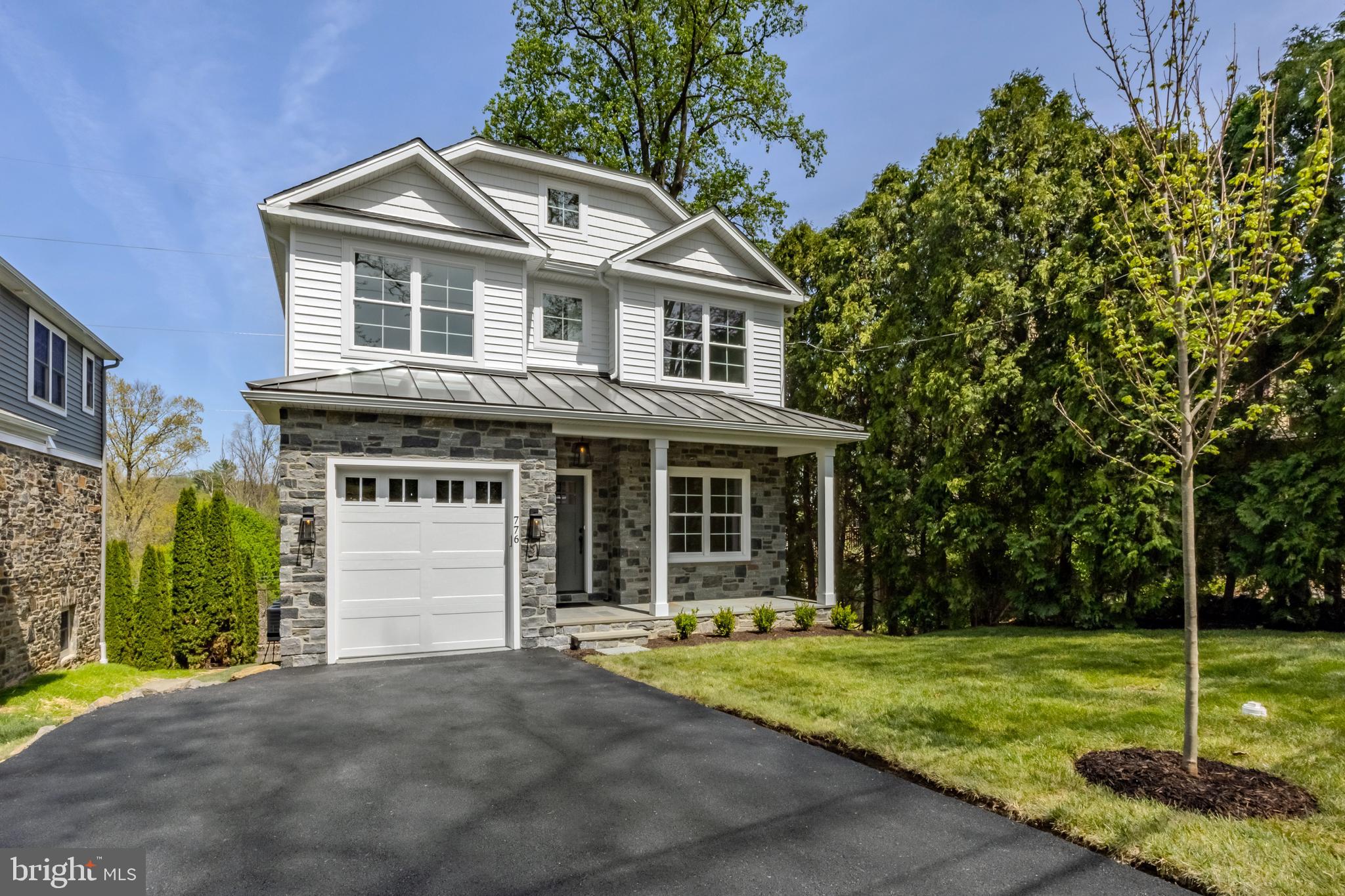 Sposato Homes presents another beautiful New Custom Built home on Lawson in Havertown! Designed to fit into the neighborhood, this 2 story colonial catches your eyes with a stone & siding front, standing seam pent roof over a front porch with stone floor, and multiple gables giving the home great dimension, style and curb appeal. Walking up you'll find the newly paved driveway for 2 cars, 1 car attached garage, freshly poured sidewalks and curbing, and a fully landscaped yard with fresh sod, plantings and newly planted trees. The welcoming, covered front porch gives you a great place to sit, relax and stay dry before entering the the home. Engineered wide plank white oak flooring leads the way as you step into the home that offers 9 foot ceilings throughout the 1st floor. Great site lines and a semi-open floor plan allow you to see from the front to the back of the home. To your right you'll find a great space with a custom millwork accent wall that could be a den, office or formal living room. To you left, a nicely located mud room space that offers built in storage cubbies and connects to the 1 car attached garage, as well as, the 1st floor half bath and separate coat closet with custom organizers. Continuing, an open formal dining room space with wainscoting sits to your right and looks across to a stunning open kitchen with center island. The kitchen includes white wall & base cabinetry, along with an accented wood cabinetry for the center island. You'll notice stylish pendant lighting and recessed lighting, along with a beautiful range hood over the stainless steel oven. White Quartz counter tops and backsplash present a very clean look with with black accents on the cabinet pools and faucet. The kitchen also offers a pantry closet and overlooks both the breakfast area and great room with gas burning fireplace. Large windows and a door along the back wall of the kitchen and great room space let in lots of natural light and give a view out onto the raised back composite deck and valley beyond. An open staircase leads up to the second floor where you'll find 2 ensuite bedrooms, 2 additional bedrooms, a well located and generously sized laundry room and hall bath with tub and double sink. The Primary suite offers 2 walk-in closets, along with a luxurious primary bath that offers a stand alone soaking tub, a large walk in shower with elegant tile surround and seamless glass door, and 2 vanities along the far wall. Heading back downstairs, a finished staircase off the first floor hall leads down to the open, unfinished basement that includes 1,316 sq/ft of usuable, high ceiling space, as well as, windows and walk out slider door off the back, leading to the rear yard. This high quality custom build includes 2 zone, high efficiency HVAC, 200 amp electrical, insulated windows and doors throughout, and many other great details you'll appreciate. Located in the highly desirable sidewalk neighborhood of Penfield, this location is a short 2 block walk to the Norristown High Speed stop, around the corner from trails and parks along Karakung Dr., restaurants and shopping along Brookline Blvd., and falls into the Haverford School District and Chatham Park Elementary catchment. New construction is rare in Havertown, so don't miss your opportunity!