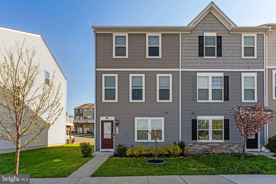 Enjoy low-maintenance living with modern style and everyday convenience in this end-unit townhome in Presidents Pointe. Built in 2021 and ideally located in Ranson, this home offers easy access to shopping, restaurants, and Route 9, making commuting and daily errands simple.

Inside, the open main level is designed for the way people live today, with 9+ ft. ceilings, luxury vinyl plank flooring, and a bright, airy layout that feels both comfortable and inviting. The kitchen is the heart of the home, featuring stainless steel appliances, quartz countertops, a farmhouse sink, and a center island that works beautifully for casual meals, conversation, or entertaining. The adjoining dining area is surrounded by windows that bring in plenty of natural light, while the living area opens to a deck for fresh air and outdoor relaxation. A half bath is also conveniently located on the main level.

The entry level offers added flexibility with a carpeted den that can serve as a home office, workout space, media room, or quiet retreat, along with a laundry area and access to the rear-entry 2-car garage with new epoxy flooring.

Upstairs, the primary suite provides a comfortable private escape with a large walk-in closet, a ceiling fan, and an ensuite bath. Two additional bedrooms and a second full bath offer room for guests, hobbies, or work-from-home needs. Thoughtful features throughout the home include Ethernet ports in every room, a programmable smart thermostat, 62-gallon water heater, video doorbell, and security system.

This is a home that combines modern comfort, practical space, and a convenient location for easy everyday living.