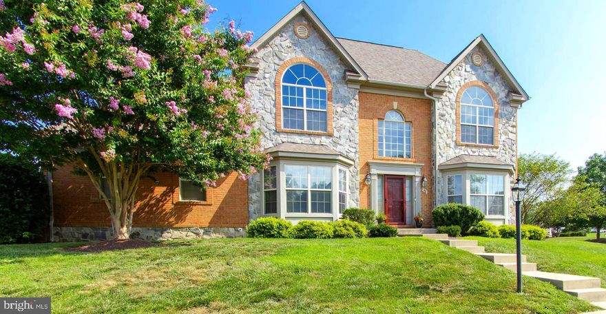 Welcome to Elegant Living in the Amenity-Rich Gated Community of Beallair in Charles Town, Wv.

This perfectly sited semi-detached home or townhome, (the rear of the home is attached),  is on a beautiful corner lot adjacent to the community park. This exquisite former model home offers luxurious living in a park-like setting—with all the comforts and conveniences you could hope for.

From the moment you step into the open grand foyer, you’ll be welcomed by warmth, natural light, and timeless design. Stunning bay and arched windows, rich hardwood floors, arched doorways, and custom mouldings to include triple crown moulding, shadow box trim, and built-ins highlight the home’s impeccable craftsmanship.

The heart of the home is a spacious great room with a cozy fireplace that's perfect for gatherings or quiet evenings. The gourmet kitchen features granite countertops, ample cabinetry, a lovely center island with extra storage and easily flows to both casual and formal dining areas via a functional Butler's space. 
The main-level primary suite is a true retreat with it's floor to ceiling bay windows, hardwood floors and custom built headboard. The main-level suite is completed with a spa-like bath including a jetted soaking tub, separate shower, private water closet, and generous walk-in closet. The four additional bedrooms and 4.5 beautifully appointed baths ensure space and privacy for family and guests.

Enjoy the ease of main-level laundry with utility sink, and a fully finished lower level with a full bath, bedroom, great space and utility space with storage and workbench. The lower level offers enough space to create multigenerational living.

Step outside to your private stamped concrete courtyard, ideal for relaxing or entertaining. With the community park just steps away, walking trails, a pool, and future fitness center being all part of the amenity-rich gated neighborhood, every day feels like a getaway.

Commuting is a breeze with quick access to all points in the DMV area and you'll be able to maintain your electric vehicle as it rests in the fully finished garage with epoxy flooring and car charging port. You'll be able to rest easy and enjoy life because the HOA fee covers the cost of lawn maintenance, leaf raking, snow removal, and trash pickup, so you can focus on enjoying your beautiful surroundings, and enjoy the community pool (currently being built). This home blends elegance, comfort, and convenience like no other—come experience it for yourself today.