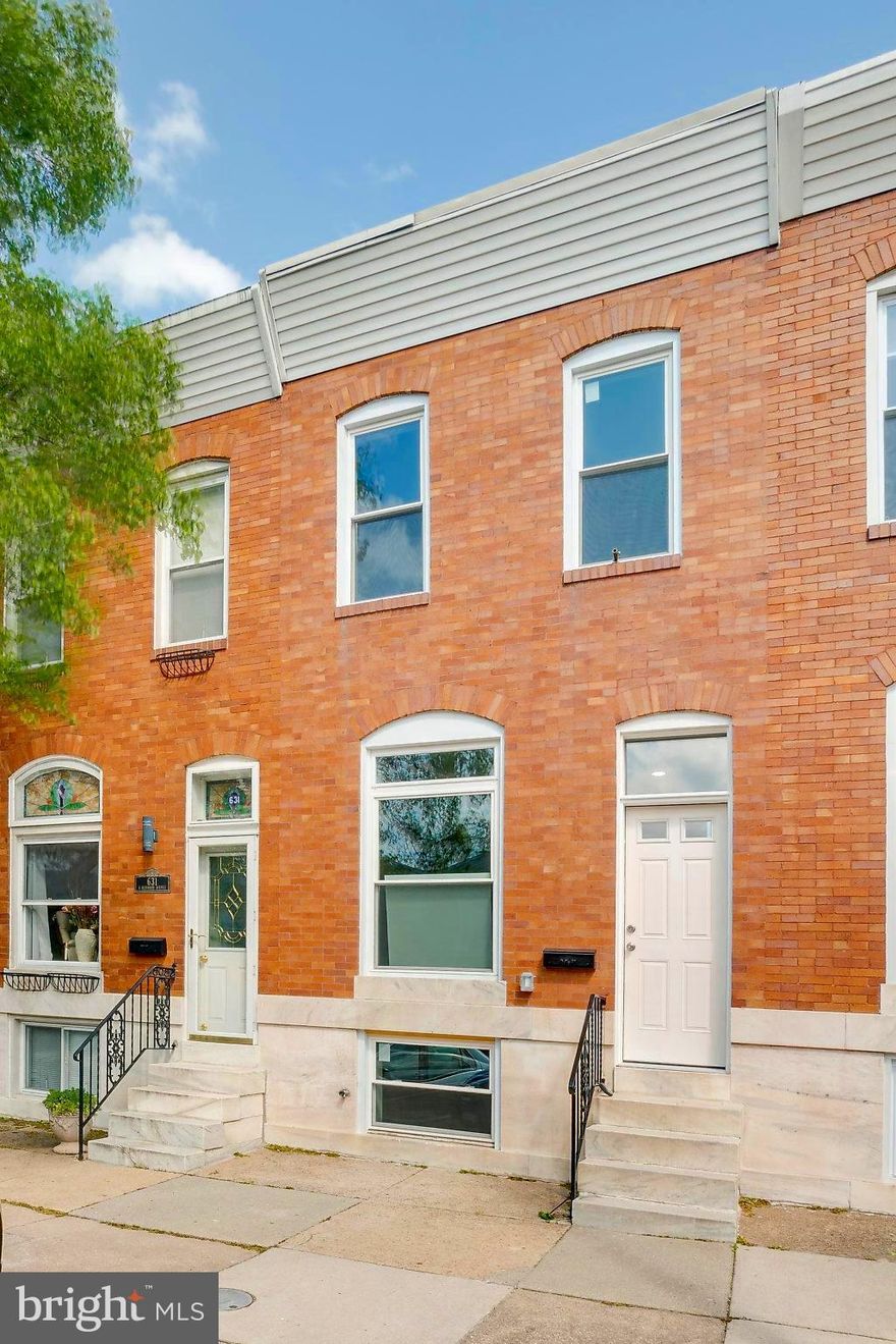 Classic Charm meets Modern Convenience! This brick  one of a kind townhouse is a couple blocks from Patterson Park close to local stores/restaurants. This house has all new permitted Electric, Plumbing, HVAC, construction. The entrance excites you with an open floor plan, custom metal staircase & railings, exposed brick wall, recessed lighting, and laminate flooring. There is a convenient powder room on the main level. The bright kitchen has granite countertops, custom soft close cabinets, black stainless steel appliances, and a granite island with seating. The upper level has a master bedroom w/full bath-tiled separate shower, glass door, granite counter. The second bedroom is steps away from the full bath in the hallway with a tub/shower, and granite countertop. And a stackable washer/dryer in the hall! The basement was dug out to give high ceilings. There is a third bedroom with double doors and a full bath with a tub/shower & granite counter top. The Utilities are all neatly in closets in the finished basement. The rear has a concrete patio. Move in ready! Can call me  fora video walk thru if you like.