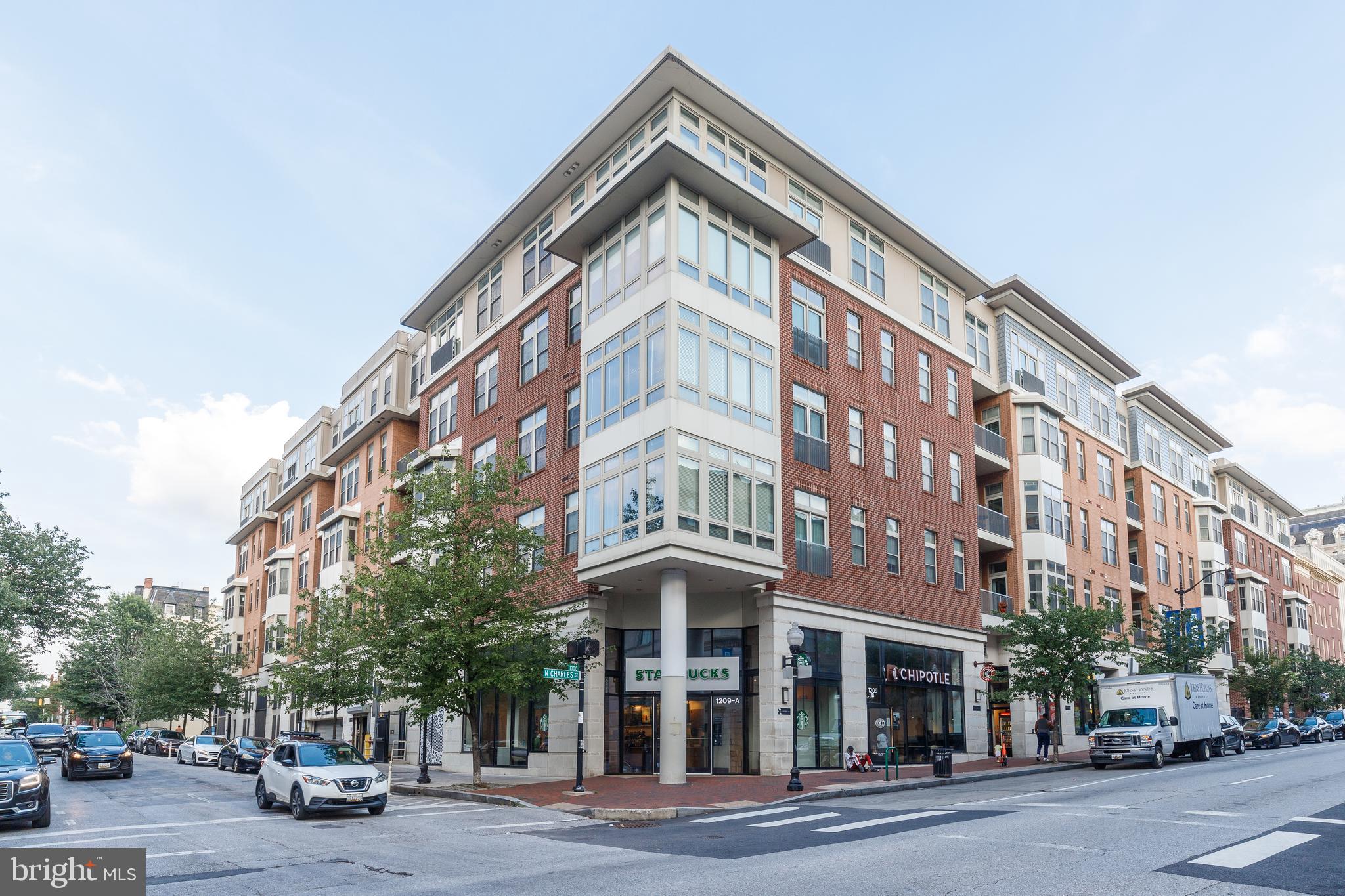 Rare opportunity to own a stunning 2-bedroom, 2-bathroom condo in the sought-after Twelve09 building, offering unmatched views of historic Mt. Vernon right from your private balcony! Perfectly located just blocks from the University of Baltimore and steps from the Baltimore Symphony Orchestra and the Baltimore Theatre Project Performing Arts Center. With Starbucks and Chipotle conveniently located on the ground level, and easy access to I-83, I-395, and Route 40, this home is the epitome of city living with everyday convenience.
Step inside to a bright and open floor plan featuring floor-to-ceiling windows, tall ceilings, and gleaming hardwood floors throughout. The gourmet kitchen is a true showstopper with granite countertops, stainless steel appliances, and stylish pendant lighting.
One wing of the unit includes a full bath with dual access and an oversized bedroom with double doors, generous closet space, and large windows. The primary suite is your own private retreat, complete with a spa-inspired bathroom featuring dual vanity sinks, a massive walk-in shower, and an expansive walk-in closet. Access the balcony from both the living area and the secondary bedroom.
Enjoy access to the building’s private courtyard, fitness center, and more. Don’t miss this rare chance to live in one of Baltimore’s most vibrant and walkable neighborhoods!