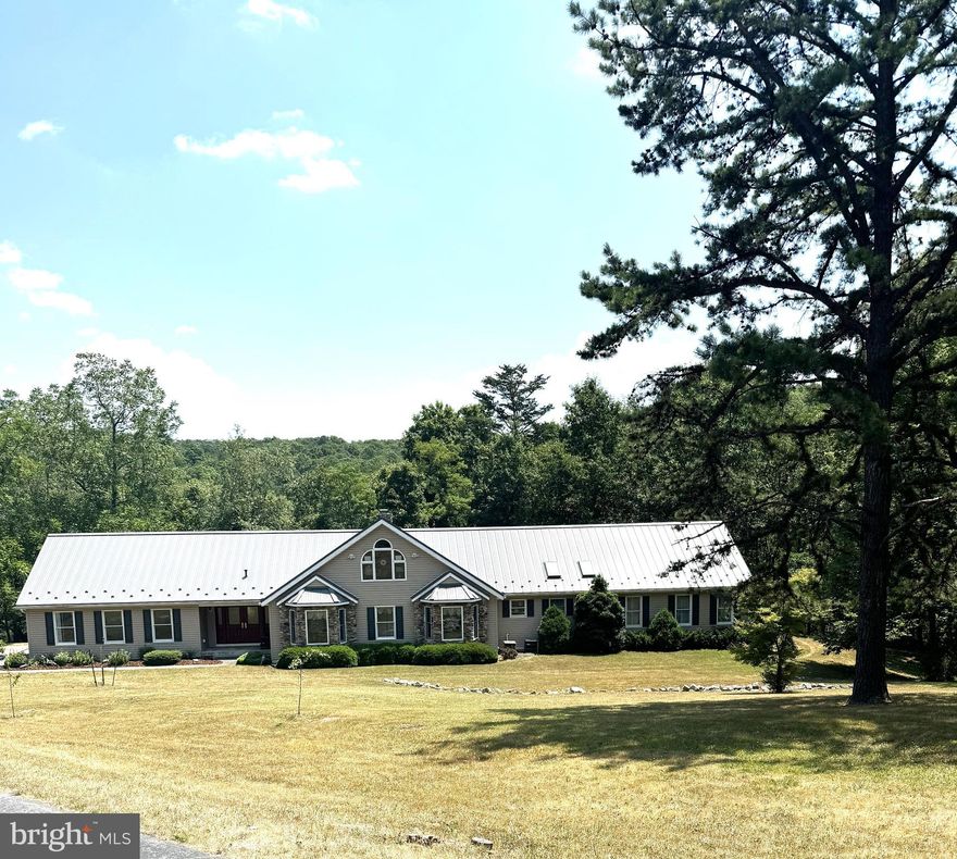 Beautiful setting and Beautiful Ranch home, has all the bells and whistles, Survey being done , but seller and tax card shows appx. 123+- acres. Detached oversized garage with upstairs storage space. Ranch home has a 2 car attached garage and spacious kitchen and large pantry, Open concept large living room with stone wood fireplace. Bright and cheery all season room. Huge primary bedroom with walk-in closet, large bathroom. 2 other decent size bedrooms. all have sliding doors for the view and lead to the wraparound deck. 2nd full bathroom . Nice main floor laundry area, foyer and half bath on main floor. Loft area overlooking the entire living room . Room currently used as an office ,but could easily be a 4th bedroom. Heat is propane and has Central air. Outside has complete privacy with paved circular driveway. Most of the ground is wooded, it is truly a hunters paradise and also adjoins State Game lands.
