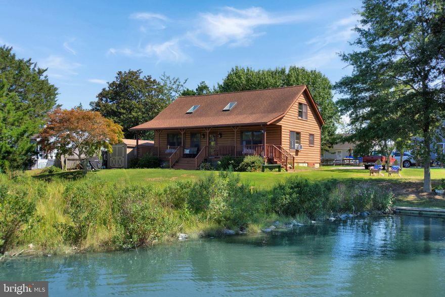 Waterfront home on Carrs Creek with access to Chesapeake Bay.  Enjoy broad water views from everywhere on this .35 acre lot in Deale Beach. Within a few minutes of waterfront restaurants, South County Cafe, marinas, shops, library. Also, Black Market Bakers just opened on Deale Churchton Rd! Wonderful location just 45 minutes to downtown Wash D.C., or BWI Airport near Baltimore. 25 minutes to our historic state capital, colonial Annapolis. 
The waterfront lot next door is also offered for sale and features 60' of bulkheaded waterfront, 2 private piers and a boat launching ramp! See the lot listing for 964 Main Street! Purchase both and have it all, plus the investment of a buildable waterfront lot! The home offers a 1st floor bedrooms, second bedroom  plus a large loft bedroom area upstairs with view of water and living room below. Lots of beautiful natural wood interior, open, floor plan. Deale Beach features a community clubhouse on the water, right on Main St