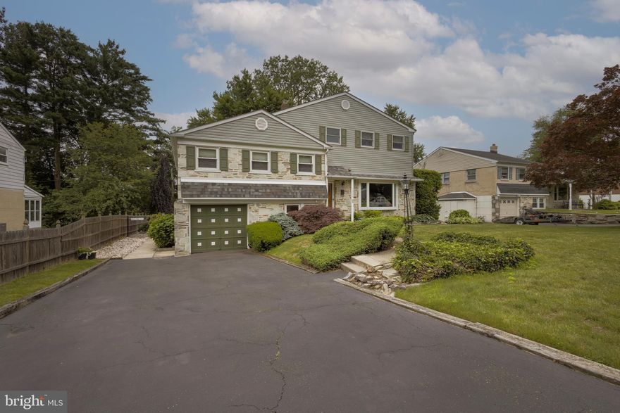 Experience spacious living in this 4 bedroom, 3.5 bath split level home in the highly desired community of Brentwood Manor in Abington Township.  Located in the neighborhood behind the Target, this home is close to all the local shops, restaurants and grocery stores as well as easy access to all major routes of travel (PA Turnpike, York Rd, Easton Rd). Just minutes from the Willow Grove or Rosyln Train Station, the location of this home is a commuters dream.  With the addition that was built in 1993, this 3000+ square foot home is sure to please.  Featuring expansive rooms throughout, this home offers the ideal layout for hosting gatherings and everyday living.   The open concept living and dining areas with hardwood floors flow effortlessly into one another and are bathed in natural light thanks to the bay picture window in the living room and wall of windows in the dining room. The dining area features a glass door that leads directly onto the Timbertek deck, perfect for indoor-outdoor entertaining.  Adjacent to the dining area is the eat in kitchen with wood cabinetry and stainless-steel appliances.  A large picture window overlooking the back yard provides an abundance of natural light.  One of the highlights of this home is the backyard with its multi-tiered covered deck and paver patio.  The mature landscape provides privacy and flowering perennials makes this fully fenced in yard a peaceful oasis. The oversized shed was built in 2005 and is large enough to hold all your lawn and gardening needs. The 2nd level of the home you will find 3 large bedrooms, all carpeted, as well as 2 full baths with nicely maintained vintage mid-century tile.  One of bedrooms(currently being used as an office) was the primary bedroom prior to the addition and comes complete with its own full bath and large closet.   Just a few steps up and you will enter the 3rd floor addition with its high ceilings and hardwood floors, this 650+ sq foot space will become your own private paradise.  Not only is it the 4th bedroom but you also have an adjacent sitting room, which could have many uses, walk in closet, full bath with 2 person jetted soaking tub, walk in shower and bidet as well as the piece de resistance; the laundry room. No more walking up and down stairs to get your laundry done. Access to the attic with its abundant storage space can be found in the laundry room as well.   The carpeted lower-level family room was updated in 2015 with new windows and door for exterior access as well as a wood burning fireplace.  On this level, you will also find a 1/2 bath, workshop and storage space, and access to the 1 car garage. This home was updated to 3 zones in 1993 with the addition to make it more energy and cost efficient, new roof installed in 2018, new 75-gallon hot water heater in 2022 and updated the HVAC system in 2019.  Home has an attic fan and Gutter Helmet gutter guards as well.  Abington School District and within walking distance to Overlook Elementary.  After 39 years in this beloved home, the sellers are ready to pass it on to new owners to create their own lasting memories. Make your appointment today to see this special home.
