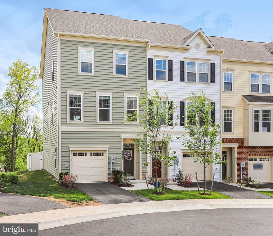 LIKE-NEW DESIGNER END UNIT TOWNHOME WITH MODERN UPGRADES & THOUGHTFUL DETAILS!
Welcome to this beautifully appointed 3-bedroom, 2.5-bath townhome offering a spacious, open-concept floor plan and upscale finishes throughout. Only two years young, this move-in ready home combines style, comfort, and functionality for today’s lifestyle. The heart of the home is the grand gourmet kitchen, featuring a premier upgrade package with Moon White granite countertops, striking Estasi Peak black matte backsplash, stainless steel appliances, induction cooktop, and an expansive center island with bar seating, perfect for casual dining and entertaining. The adjoining dining area flows seamlessly into a light-filled, elegant living space, creating an inviting atmosphere for gatherings both large and small. Upstairs, retreat to the generous primary suite complete with a walk-in closet and a spa-inspired en-suite bath showcasing a frameless glass shower with rainfall feature, upgraded quartz countertops, and modern Moen Align fixtures. Two additional bedrooms, a stylish hall bath, and a convenient upper-level laundry area complete this level.
The finished lower-level recreation room offers flexible living space ideal for a home office, gym, or media room, with a rough-in for a future full bath, providing room to grow and customize. This home is loaded with premium upgrades including oak railings, upgraded carpet with plush padding, designer door hardware, custom window treatments, built-in speakers on main and lower levels, and smart home features like a Google Nest thermostat and ADT security system. Enjoy outdoor living with a private fenced area and easy access through the main-level sliding glass door. Additional highlights include an EV charger (SAE J1772), garage refrigerator, TV mounts that convey, USB outlets, and ample storage throughout. Ideally located just minutes from shopping, dining, parks, scenic walking trails, and everyday conveniences and close to the beloved Jimmie Cone in Damascus, a long-standing local favorite known for its classic soft-serve treats. This home offers the perfect blend of community charm and modern convenience. A rare opportunity to own a turnkey, like-new home with high-end finishes with the best premium options. Schedule your private tour today!