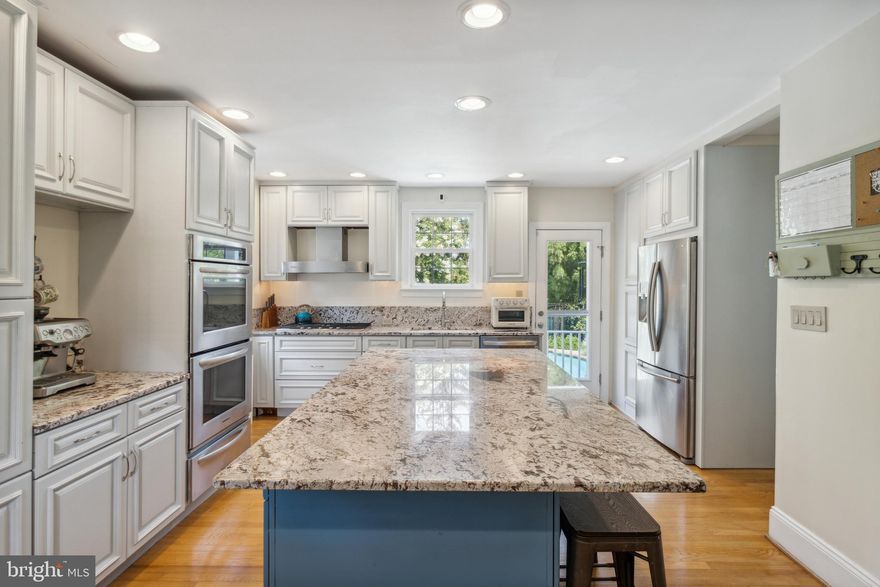 Want the perfect homes to be able to celebrate the holidays in Catonsville? Are you ready for a little slice of heaven on one of the most desirable and unique streets in downtown Catonsville? Holmehurst is almost its own little paradise, with a serene tree lined street and classic homes with brick and stone architecture, but in the heart of the charming downtown area of Catonsville.  
ARE YOU A VETERAN and interested in assuming the loan with a delightfully low interest rate of 2.5%?

Welcome to #23. A beautiful, lovingly maintained Cape Cod with distinct modern features that will surprise and delight. This home boasts 4 bedrooms and 2.5 bathrooms, offering ample space for comfort and convenience. The brick exterior exudes timeless appeal, blending harmoniously with the picturesque neighborhood. 

Step inside and the love affair continues. Harwood floors throughout the main and upper level and multiple fresh upgrades that will turn heads.

The kitchen is a chef's dream, featuring modern stainless-steel appliances, sleek countertops with a HUGE center island offering plenty of storage space within the chic cabinetry. Whip up culinary masterpieces while engaging in conversations with guests all around and in the dining space.

The living room is generous and bathed in natural light with an easy transition between all spaces. The fireplace takes center stage. 

You will find 1 bedroom on the main level and 3 bedrooms upstairs with quaint dormers. A completely renovated bathroom is a joy with delightful choices. 

As you explore further, you'll find a finished basement that can be utilized as a family room, home office, or recreation area – let your imagination run wild! A convenient full bathroom is also located on this level. A nice size storage area also provides access to the 1 car garage. 

Outside, a lush oasis will greet you. A delicious sparkling custom in-ground heated pool, complimented by an extensive hardscaping surround with a large blue stone patio. Plenty of space for outdoor activities and al fresco dining. Privacy is created by the thriving evergreens and the blooming crepe myrtle trees, 

The location of this home is truly unbeatable – nestled on a sleepy street, you'll enjoy a sense of tranquility while being just moments away from all the amenities and attractions that downtown Catonsville has to offer. Quaint shops, delicious eateries, and community parks are within easy reach, making this the perfect place to call home.

Don't miss the opportunity to make this lovely Cape Cod yours. With fresh paint throughout, a fabulous layout, and a fantastic location, this home is sure to capture your heart. Schedule a visit today and experience the charm and warmth of this Catonsville gem!