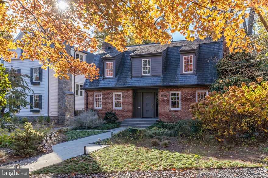 NEW PRICE! Nestled on a quiet and private tree-lined cul-de-sac in the charming North Cleveland Park neighborhood, 3540 Springland Lane brings the vision of timeless design notes paired with luxury living to life. Built in 1939, this classic Dutch Colonial showcases 5 Bedrooms, 5 Full Baths, and 1 Powder Room across 3 elegantly curated floors as well as the fully finished 20 x 20 ADU that currently serves as an Office / Studio but could be converted back to a 2-car garage. Spanning over 4,800 livable square feet, just a few of the incredible home features include beautiful 1930s walnut flooring, Pella and Weathershield windows, 3 fireplaces and a large 3-story contemporary rear addition.

The welcoming Entrance Foyer introduces the effortless and spacious layout of the Main Level. Flooded with sunlight, the Living Room is grand in scale providing multiple areas for seating while admiring the oversized mantel and fireplace. The formal Dining Room is just across the Entrance Foyer and elegantly connects to the Gourmet, high-end European Eat-In Kitchen. The sleek countertops, top-of-the-line appliances, bountiful cabinetry, built-out pantry and ample counter space exceed expectations. The large peninsula with seating for many naturally opens to the spacious combined Breakfast Room / Family Room - ideal for informal dining and large gatherings alike. Just beyond the Family Room is the Sunroom that features floor-to-ceiling windows and offers stunning French doors leading out to the idyllic Backyard. Complete with an elegant, high-ceiling veranda, 2 flagstone Patios with a natural gas connection for BBQ grills, a manicured and professionally landscaped back lawn with a custom designed wooden fence and gate, this outdoor space offers a private oasis and enviable al fresco dining and entertainment areas. Completing the Main Level is a Powder Room and back door entrance with a double door coat closet. 

With an abundance of natural light, the Office / Studio can be used as a guest house, art studio, home office, future pool house or returnable to a garage. It has been fully renovated and includes a vaulted ceiling, enough space for a dedicated sleeping area as well as a living area, Kitchenette, Full Bathroom, and its own HVAC system.  

Ascending to the Upper Level of the Main Residence is the spacious Primary Bedroom Suite offers high-vaulted ceilings, a wall of custom built-in closets, a large, windowed dressing room, and French doors leading out to a stunning private terrace overlooking the Backyard. The spa-like, ensuite Primary Bathroom showcases an antique claw foot soaking tub, a dual vanity and large walk-in shower with a bench seat and two shower heads. Completing the Upper Level are 2 additional large Bedrooms (one with a fireplace), 2 Full Bathrooms, 1 of 2 Laundry Areas, a linen closet, and a pull-down ladder to the insulated Attic.

The Lower Level showcases a large Recreation Room with a fireplace, 3000-bottle temperature-controlled Wine Cellar and a spacious Workshop / Storage / Utility Room. There is also a Guest Suite on this level that can be accessed from the Recreation Room as well as a separate entrance from the Backyard. Within the guest suite is a Bedroom and en-suite Full Bathroom, the 2nd Laundry Area, and a Mudroom.

Residing in the coveted neighborhood of North Cleveland Park, just over the historic district line, residents can enjoy easy public transportation, nearby shopping and dining, and new public tennis courts, a swimming pool and soccer fields at Hearst Park just through the pathway at the end of the cul-de-sac.