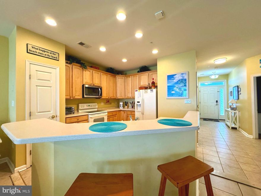 This stunning, fully furnished, top-floor, end unit condo is nestled in the highly sought-after, gated community of Sunset Island.  Offering a perfect blend of luxury, comfort, and convenience. Inside this spacious 3-bedroom, 2-bathroom condo you are greeted by an open-concept living area flooded with natural light. The kitchen has plenty of cabinet space, full appliance suite, pantry, breakfast bar, and is open to the living area making it the true heart of this home. The living room opens up to a private wrap around balcony, perfect for enjoying your morning coffee or evening sunsets with  views of the fountains, and canal. The primary suite is a true retreat that also opens to the balcony,  features a large  closet, and an en-suite bathroom with a dual vanity, soaking tub, and separate shower. The two additional bedrooms are generously sized and share a well-appointed second bathroom, ideal for family or guests. The Sunset Island community provides an array of top-notch amenities, including a private beach, indoor and outdoor pools, fitness center, walking trails, and a clubhouse. You’ll also find convenient on-site dining options and a market for your everyday needs. Located just a short distance from Ocean City’s best attractions, this condo offers the ultimate coastal lifestyle. Whether you’re looking for a year-round residence, a vacation getaway, or an investment property, this one is the perfect choice. There is special assessment by the condo. Owner has made 1 of 4 payments.  Any existing leases must be honored.