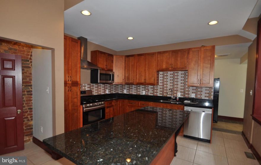 THIS IS THE ONE YOU'VE BEEN WAITING FOR!! Walk to school or work from this Victorian "mini-mansion" directly across from UMMC. Modern 4-BR/3-BA  apartment has all the space & amenities you could want. 3 bedrooms are on the main level and one is on the lower level. The basement bedroom even has it's own private entrance! Granite counters, wood floors, stainless steel appliances, washer/dryer, GIGANTIC BEDROOMS, 10' ceilings, a shared patio and much, much more. ALL UTILITIES ARE INCLUDED IN THE RENT (limits apply)! Sorry, no pets allowed. No smoking in the apartment. WELCOME HOME!!