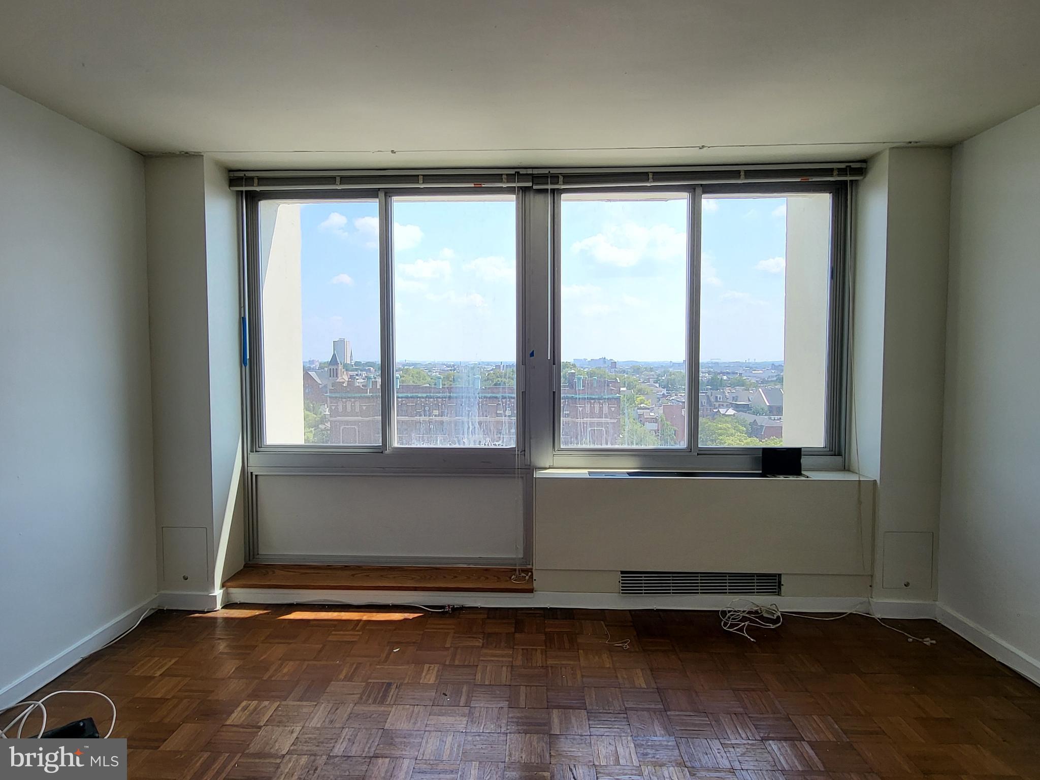 Sun-soaked studio with southern views at Hopkinson House on Washington Square! Enter through a foyer with large coat closet into the open great room beaming with natural light from oversized windows showcasing southern city views. Adjacent is the fully equipped kitchen with ample cabinetry and tile backsplash. There is a separate dressing area with excellent closet space that leads to the full bathroom boasting a tub shower with white tilework and a white tile floor. Additionally this home enjoys parquet wood floors and excellent storage space throughout. Residents of Hopkinson House enjoy a 24-hour doorman and on-site management. There is a seasonal rooftop pool with see-forever city views and valet parking in the building for an additional fee, subject to availability. Hopkinson House is in close proximity to many of the city's historic and cultural sites, some of the city's best shopping and dining and provides easy access to the Broad Street and Market Street office corridors, as well as 676, 95, Amtrak's 30th Street Station and the Philadelphia International Airport.