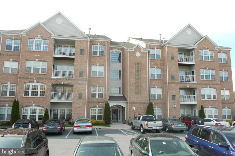 GRANITE COUNTER TOPS IN KITCHEN AND MBATH, WOOD FLOORS IN FOYER & KITCHEN, MARBLE SURROUND AND MANTLE ON GAS CORNER FIREPLACE, PLANTATION SHUTTERS & BLINDS, CUSTOM CLOSET IN MASTER BEDROOM, STAINLESS STEEL APPLIANCES, CROWN MOLDINGS, STORAGE ROOM IN HALLWAY. THIS SECOND FLOOR UNIT FACES THE FRONT.