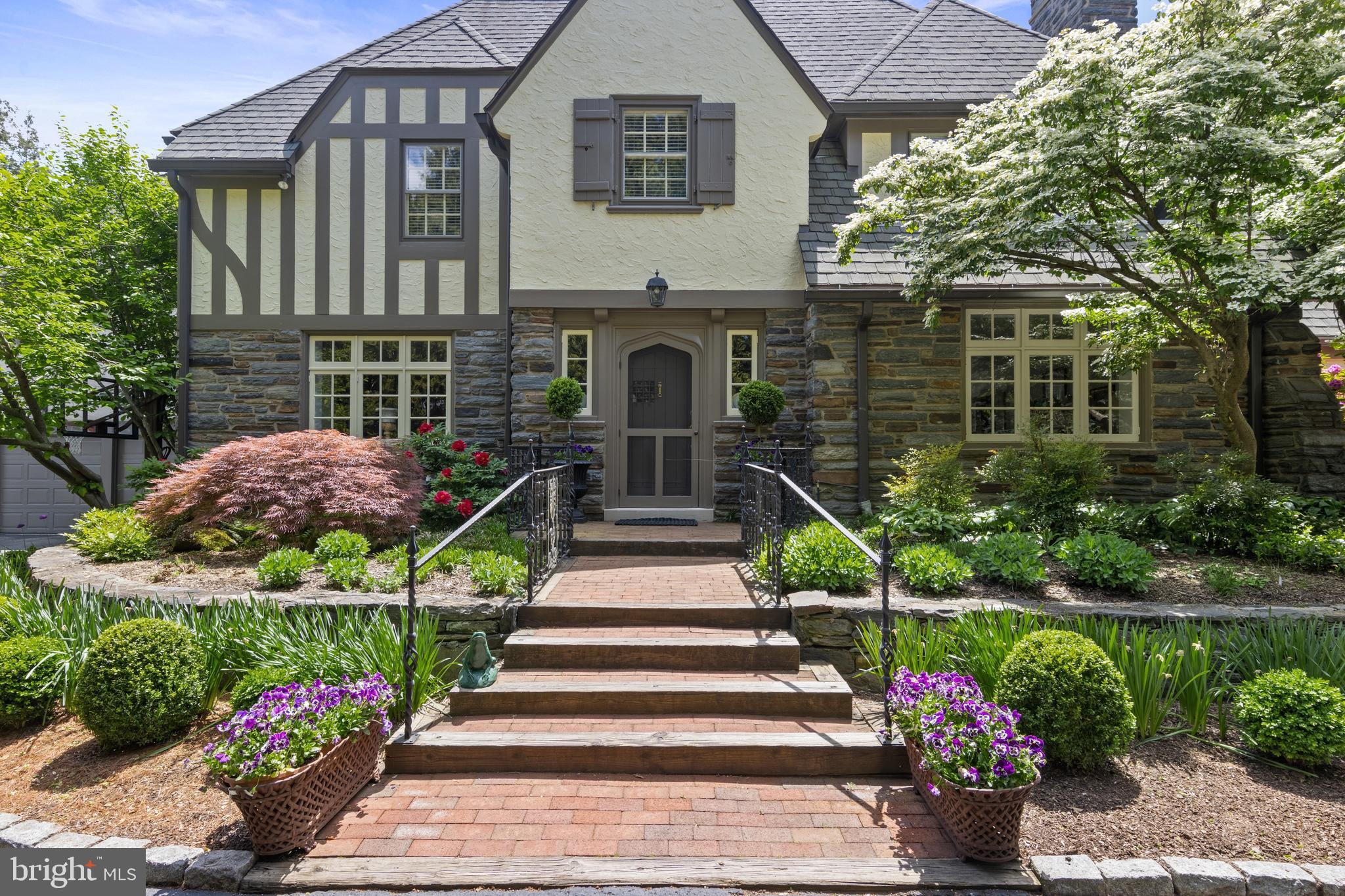 Welcome to 1307 Pine Rd! Gracious traditional Wallace and Warner 5 bedroom/4.5 bath 3-story English Tudor with archways, elegant moldings, chair rails and flooring all crafted to perfection. First floor features an elegant center hall foyer, traditional dining room with a built-in china closet, and a beautifully appointed large living room with magnificent marble surround fireplace, adjacent to a warm and inviting den with built-ins overlooking the patio. Gardner/Fox renovated gourmet kitchen provides a full range of amenities while respecting the special character of the house. Features include Kountry Kraft custom cabinets, granite countertops, Dacor and Sub-Zero appliances, with convenient back stairs to the second floor. The 2nd floor boasts a primary bedroom ensuite with an updated bathroom featuring quartzite countertops with Waterworks fixtures, another ensuite bedroom, hall bathroom and two additional bedrooms along with a spacious, second floor family/media room. All bedrooms include California Closets. The 3rd floor offers an additional bedroom with vaulted beamed ceiling, closets and a newly updated window. Enjoy recreation and more in the finished lower level which features a full bathroom and cedar closet. Outside is beautiful, lush landscaping and a wonderfully restored pool. Additional amenities include a 3-car garage, new 2-zone A/C units, 2011 roof replacement, and a new whole house generator. This home has been meticulously maintained with attention to detail evident throughout and is located in a desirable Northside Bryn Mawr neighborhood!