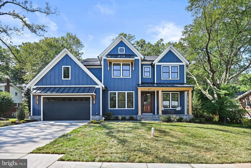 Welcome to Vienna Development Alliance's latest offering, a rare combination of an idyllic location and an ultra high-end spec level.  Situated in a quiet cul de sac on an oversized 16,000 square foot (.37 acre) perfectly rectangular and flat lot, this Modern Farmhouse will dazzle with its dramatic front elevation, which features a large front porch with cedar columns and ceiling as well as a standing seam metal roof, awning build outs with cedar brackets and standing seam metal roofs, a natural stone veneer water table, and a magnificent Sapele Mahogany front door.  Rounding out the exterior are ultra high-end Marvin Elevate windows and patio doors with an Ebony cladding inside and out.  The kitchen features a full Wolf/Sub-Zero appliance package, stacked shaker cabinets with custom hood, quartz countertops with matching backsplash, a cast iron farmhouse sink, and a massive island.  The entire main and upper levels (excluding tile areas) are covered with white oak floors exquisitely finished on site with water-based top coats.  Off the expansive family room is a fully outfitted screened deck, while off the breakfast room is an adjacent open deck, perfect for grilling and including a gas stub out.  Both decks overlook the vast, flat backyard.  Cedar beams, shiplap accents, ceiling effects, wainscoting detail, and elaborate built-ins are sprinkled throughout the house.  Upstairs, the three secondary bedrooms all include en-suite bathrooms and walk-in closets and the laundry room includes generous cabinetry and a soaker sink.  The master suite is a true oasis with a sun-filled sitting area, oversized sleeping quarters, a massive, fully built-in closet with center island, and a spa-like master bath.  The basement offers plenty of space to stretch out with a luxurious feel provided by the LVP flooring over a fully leveled slab.  Enjoy movies and the big games in the massive rec room with a full wet bar and game area.  A bedroom, full bath, and bonus room round out the lower level.  Don't miss out!