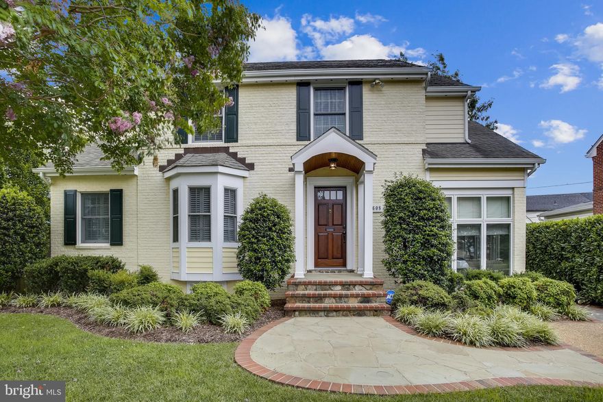 Few homes built in 1946 can claim to be better than new, but this special Colonial on a tree-lined street in sought-after Jefferson Park does just that. Along with fine bones + renovations made in 2008 + 2017, the present owners have reconfigured + customized space + incorporated top-of-the-line improvements. The floor plan provides flexibility in the use of rooms as well as space for family members to enjoy time together or alone + offers a variety of interior + exterior entertaining venues. The painted brick + Hardi board exterior is accentuated by thoughtful landscaping.  Follow the stabilized gravel driveway to the front door with classic portico by way of the walkway and landing of brick surrounded by slate. A wide, welcoming foyer has a comfortable seating area and sanded + refinished hardwood floors + crown moulding as seen throughout the main level.The elegant, light-filled, oversized living room has north, east + south-facing shuttered windows. An entertainment storage shelf has been installed above the gas fireplace with handsome mantel.The dining room, with shuttered bay window, has seating for eight + allows for plenty of entertaining space in front of the custom cabinetry, a countertop of white with grey-veined quartz + a wine refrigerator. The gorgeous quartz countertop design carries into the refinished kitchen with top-of-the-line JennAir appliances + white cabinetry. This room leads to a peaceful breakfast room with bay window + a door to a rear landing + steps to the backyard is a perfect grilling spot. From the foyer, follow the lantern lighting to the sunroom. Formerly a porch, the room has been transformed into a lovely area in which to enjoy the outdoors from eight tall windows. A bead board wall has three additional east-facing windows + a window seat. Finishing touches include a bead board ceiling + a brick wall with port hole window. A Craftsman-style three-lite door leads to the driveway + gate to the fully fenced rear yard. The half bath off the main hallway features custom Paris-themed wallpaper + a white vanity with grey-veined quartz countertop. Proceed to the upper level with hardwood flooring, white wood window blinds and a unique configuration of owners’ suite plus two bedrooms, each with their own baths. The private owners’ suite, with two walk-in closets, has plenty of space for a king size bed + sitting area. The enviable owners’ bath with double vanity has an oversized affinity shower with two rain shower heads. Light flows into the two bedrooms, each with walk-in closets + baths featuring subway tile in the bathtubs + white cabinetry. A finished basement substantially expands the living space. Tasteful carpet with a herringbone weave covers the stairwell, hall, hall storage closet + a fourth lower-level bedroom with a bead board wall + an egress window. A full bath with subway tiled shower + white cabinetry serves the lower level. The rec room has engineered hardwood floors + Hopper windows for added light. A gas fireplace + entertainment storage shelf of the same design as in the living room are flanked by matching bookshelves + cabinetry. A door leads to the backyard by way of an exterior stairwell. The laundry room has a refrigerator + LG washer + dryer, a laundry chute + a wall of cabinetry. An attic + storage closets provide additional interior storage while a huge storage shed functions for exterior storage. The rear yard offers a private spot for rest as well as entertaining. A stone terrace with brick surround, partially enclosed by a stone wall, lends space for a large rectangular table for six + a separate seating area. Security is provided by an alarm system + exterior solar lighting. Restaurants, shopping, churches + schools are within a few minutes drive. With an easy walking distance of 1.3 miles to the Braddock Road metro, it is also within minutes of 395 to all points north + south + to the Rt. 1 corridor featuring the VA. Tech Graduate School +Amazon HQ2 sites.