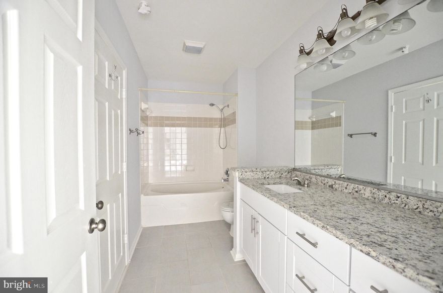 RENOVATED UNIT! BRIGHT TOP FLOOR! NEW PAINT AND NEW CARPET IN THE ENTIRE UNIT. NEW TILE IN THE KITCHEN, STAINLESS APPLIANCES WITH GRANITE AND NEW FLOORING TITLE. BALCONY OFF THE FAMILY ROOM WITH FIREPLACE. VIEW ON THE POOL. NEW WHITE BATHROOM CABINET WITH GRANITE. THIS CONDO HAS LOTS OF LIVING SPACE AND PLENTY OF STORAGE. VAULTED CEILING! FANTASTIC COMMUTER LOCATION, EASY ACCESS TO RT 7,  RT 28 AND ONE LOUDOUN. CLOSE TO RESTAURANTS, SHOPS, ALAMO MOVIE THEATER AND TRADER'S JOE GROCERY STORE.