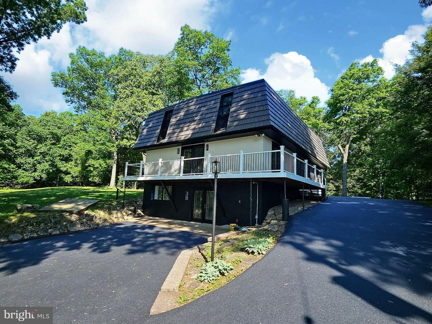 Welcome to **38 Dogwood Dr, Fleetwood, PA 19522** — a truly exceptional secluded country retreat nestled on over 3 private acres of peaceful surroundings. This stunning, like new contemporary home offers the perfect blend of luxury, space, and versatility, ideal for multi generational living, horse enthusiasts, or anyone seeking privacy without sacrificing comfort and elegance.

Step inside to an impressive open concept layout featuring soaring cathedral ceilings, abundant natural light, elegant finishes, and two beautiful stone fireplace inserts that create a warm and inviting atmosphere throughout the home. The spacious main level offers a first floor bedroom, full bath, convenient laundry room, and a beautifully designed kitchen that flows seamlessly into the dining and living areas, perfect for entertaining and everyday living.

The upper level showcases a spectacular loft landing area overlooking the main living space, along with 3 generously sized bedrooms, each featuring its own private full bathroom, creating the ultimate comfort and privacy for family members or guests.

The fully finished lower level expands the living space even further with 2 additional bedrooms, a full bathroom, a large family room, and a wet bar, making it an ideal setup for in laws, guests, or extended entertaining.

Outside, enjoy the serenity and endless possibilities of your private acreage, complete with a massive 10+ car driveway and room to accommodate horses, recreational activities, or future additions.

This one of a kind property offers the rare combination of luxury, privacy, functionality, and flexibility, all in a breathtaking country setting. Don’t miss the opportunity to own this extraordinary home!
