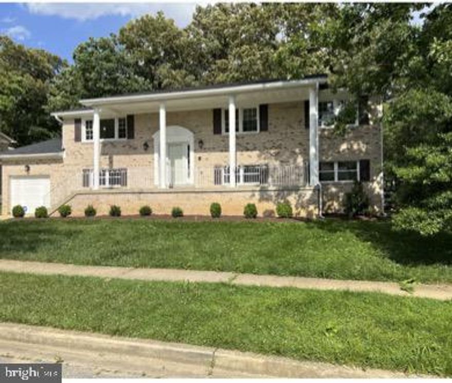 Beautifully renovated large brick split foyer with a great backyard.  5 Bedrooms, 3 Full Baths, all new wood floors, new kitchen with stainless steel appliances.  Year round sunporch to enjoy even during the cold wintry nights.  Imagine the holidays and entertaining guests in this delightful overflow of space.  The lower level features 2 bedrooms, large family room with a magnificent fireplace for added ambiance.   The foyer, with the cascading stair rails, is sure to impress your guests.  New garage door on order and will be installed within weeks.  Home has security system and the monitoring cost is included in the monthly rent.