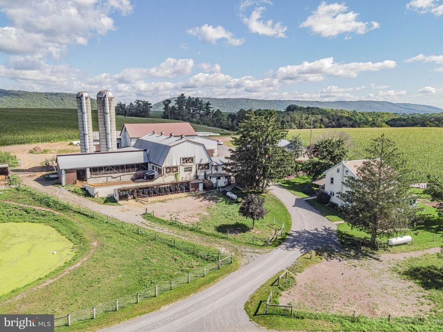 75-acre dairy farm for sale w/52 tie stalls, 55 acres tillable, 10+ acres pasture, and 5 bedroom farmhouse. The bank barn lower level has 102x37 tie stall area, 45x65 heifer barn area,  & 34x54 horse barn area. The upper level of the bank barn L shaped with 37x102 and also 35x55. There are two silos, and he milk house has a 1,000 gallon tank and is 16x18. There are slatted manure pits, one is under the heifer barn and a second one under the under the cow stable. The calf shed is 62x12, garage / equipment shed is 27x16, equipment shed 46x25, three car garage / carriage shed 20x30, and 34x60 shop with three garage doors 14’ high and 10’ wide. There are smaller storage sheds and a diesel generator shed. Additional structures including a horse barn, hay barns, a calf shed, and garages/equipment buildings ensure all your agricultural needs are met. This farm has solar potential. The charming farmhouse, with its 5 bedrooms and 1 bathroom, provides ample space for your family amidst the stunning backdrop of rolling hills and mountain views. Enjoy the serenity of your private location and unwind by the peaceful pond, or explore the beautiful countryside that surrounds this exceptional property.