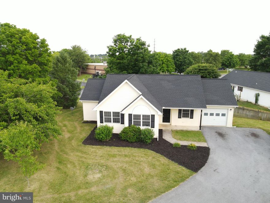 Welcome to 80 Hummingbird Lane, a charming single-family home nestled in the peaceful community of Falling Waters, West Virginia. This delightful residence boasts a comfortable 1,301 square feet of living space, perfectly situated on a generous 0.3-acre lot.
The home features three cozy bedrooms and two full bathrooms, providing ample space for family and guests alike. The heart of the home is the open-concept living area, complete with a large glass panel door that opens to the fenced back yard, creating a sense of space and flooding the space with light. Outside, the fenced backyard provides security for pets and children.
Built in 1995, this home has been well-maintained and is ready for its new owners to add their personal touch. The roof was replaced May 2024 and the interior adorns a fresh coat of paint. HOA fees cover access to the community pool, tennis courts, playground, and walking trail. Schedule your visit today and take the first step towards making this house your new home in this highly desirable neighborhood.