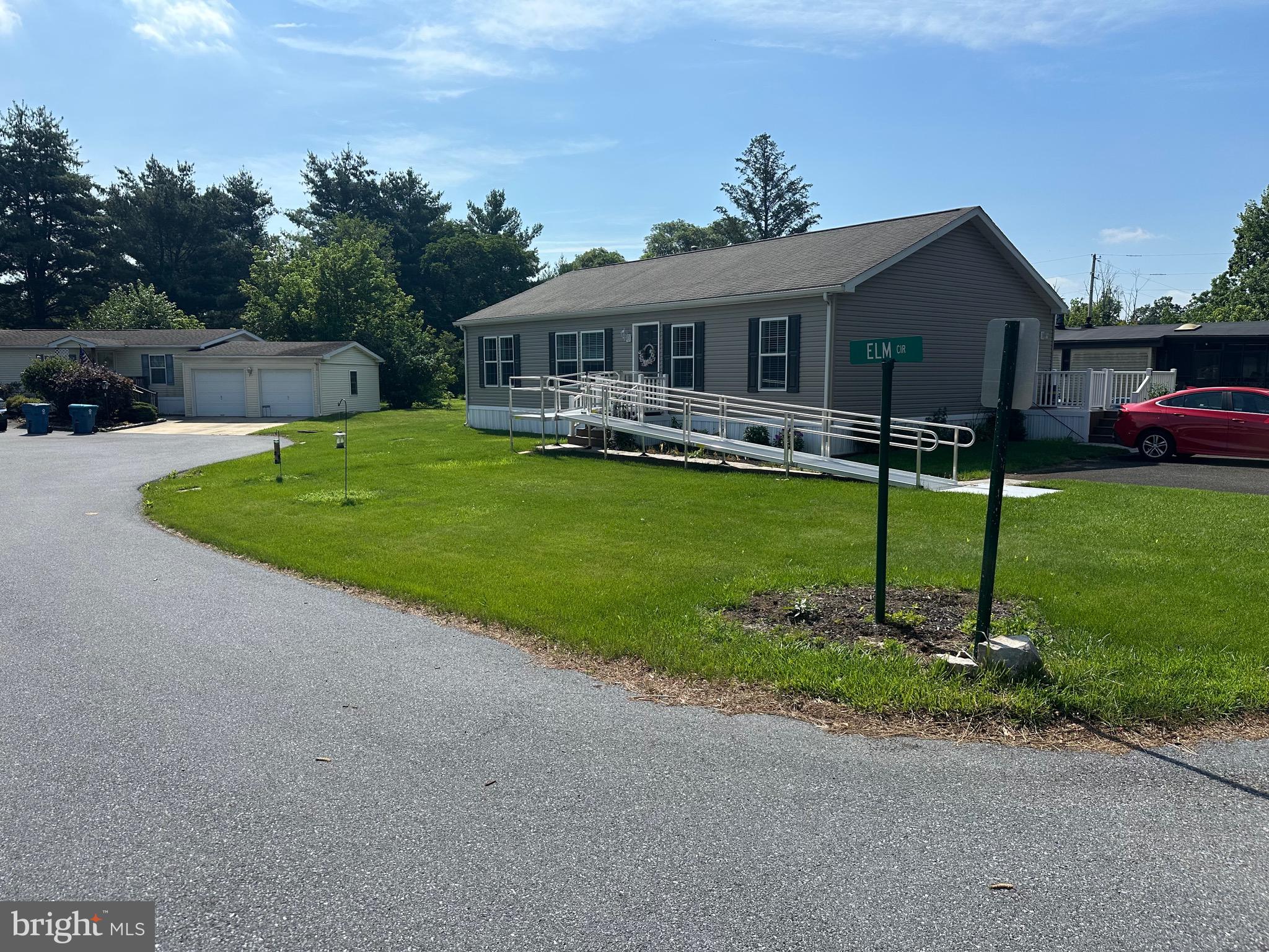 A nicely landscaped corner lot is the setting for this well maintained 2017 Pine Grove home, The kitchen has lots of cabinet space .an island and stainless appliances and is part of the open concept living for easy furniture placement, The monthly land lease of $941 includes 1500 gallons of water/sewer use, pool ,mini golf ,chip and putt, fishing ponds and use of the community hall for private functions .Park approval required