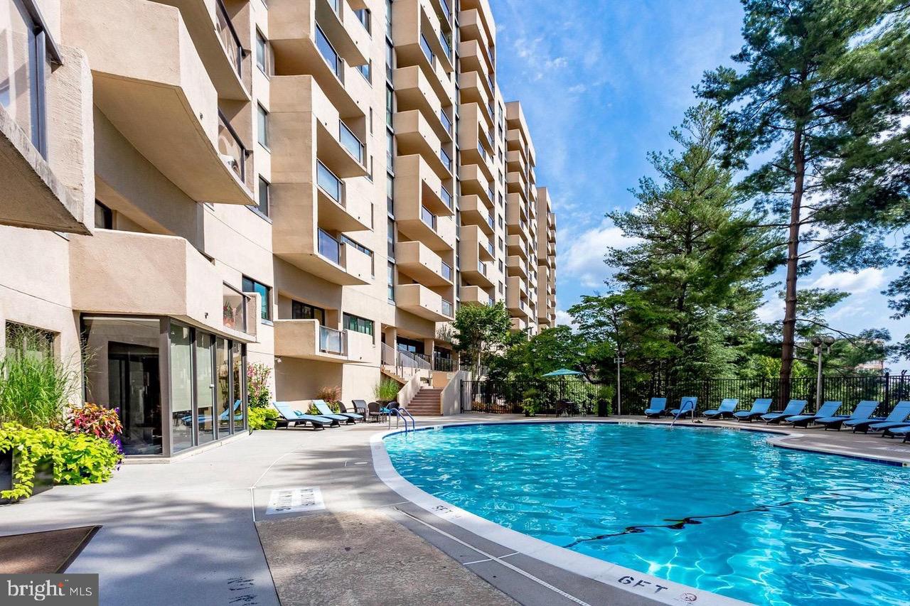 Large (1603 sq foot) 2 bedroom/ 2.5 bathrooms with tons of closet space facing the City and view of the outdoor pool. Sit on your balcony and watch the 4th of July fireworks! This unit comes with one-garage parking space 10 X 18 (P2 Level / Space #P2-15) and a bike rack mounted to the wall, plus a bike storage area nearby. Dont miss the EXTRA storage room #704 (5.5' X 8.25') on the same level as the unit, This luxury building has an exercise room, party room and outdoor pool. You also have a 24-hour front desk staff person. Monthly Condo Fee $1,165/mo covers Trash/ Fitness Center/ Security/ Pool/ Laundry Facility/ and Building Maintenance. Only a few short blocks to Amazon HQ2, Pentagon, Mall and Metro, plus a number of outdoor cafe's and restaurants. Features included: a gourmet kitchen, nice appliance package, washer & dryer in unit, separate storage unit, spacious refrigerator, private building outdoor pool and 24-hour front desk service. The open floor plan seamlessly blends the kitchen and dining areas, creating an inviting space for entertaining, plus there is a separate outside door to access the kitchen. Hardwood floors in the living and dining room area, plus foyer. Luxury carpet in both bedrooms. The primary bath offers a walk-in shower and separate tub for those days you just want to relax a bit more. Master bedroom also has a dressing area with three walk-in closets.