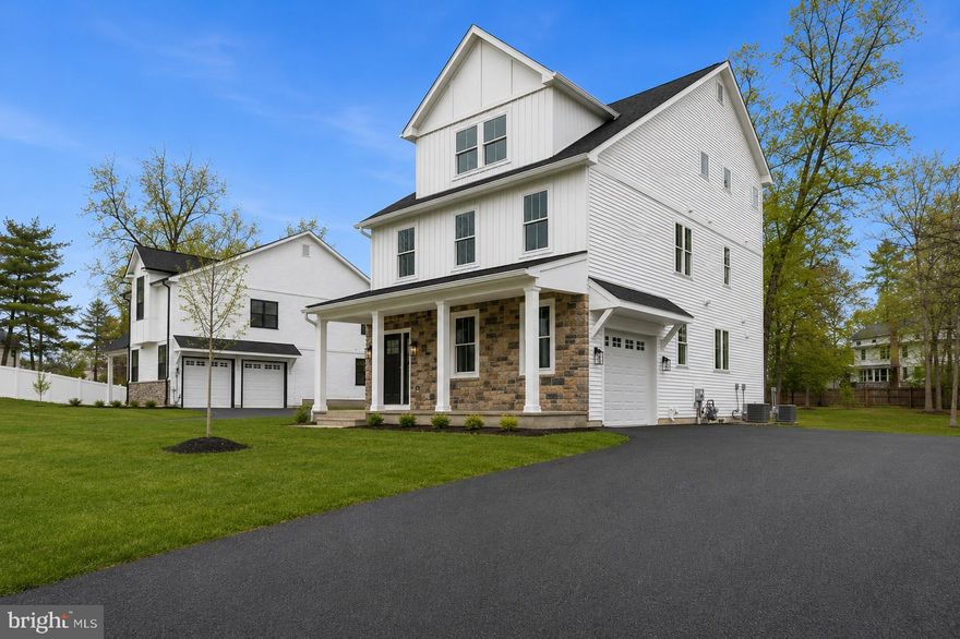 14 Churchville Lane is one of just three custom-built modern farmhouse residences in the Churchville Pointe enclave, offering newly constructed living space across three finished levels within the highly regarded Council Rock School District. The home includes 5 bedrooms, 4.5 bathrooms, and an oversized interior garage, combining contemporary finishes with a thoughtful layout designed for comfortable everyday living.

Interior features include wide-plank white oak flooring, recessed lighting throughout, Cat-6 wiring for high-speed internet and sound, and pre-wiring for ceiling fans in multiple rooms. The open living spaces are anchored by a gas fireplace and connect seamlessly to the kitchen, which features white cabinetry, white countertops, stainless steel appliances including a wine refrigerator, and a full-height backsplash that extends to the ceiling behind the range. The center island includes a dining overhang with contemporary wood accent detailing, creating both a practical gathering space and a strong visual focal point.

The home’s three-level bedroom layout provides excellent separation and flexibility, with the primary suite located on the second floor and three additional bedrooms positioned on the third level, creating a sense of privacy and spaciousness rarely found in new construction.

Additional living space is provided by the daylight walk-up lower level with high ceilings, a full bathroom, and exterior stair access, offering flexibility for recreation, guests, fitness, or media use. Outdoor living includes a large elevated Trex deck, while the home also offers quality construction and modern systems throughout.

Located just minutes from Richboro, Newtown, and New Hope, the property offers convenient access to shopping, dining, and commuting routes while maintaining the quiet character that makes Churchville one of Bucks County’s most desirable settings.  Builder is offering financing incentives through preferred lender which may include below market interest rates for qualified buyers.