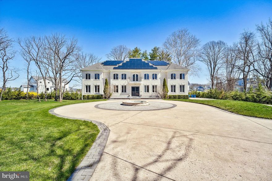 Experience timeless sophistication and cutting-edge innovation in this custom 4-sided Brick, Contemporary French-style estate, gracefully set on 1.58 acres in McLean’s prestigious Langley High School pyramid. Offering 12,045 square feet of finished living space across 4 levels, this 5-bedroom, 7.5-bath residence blends classic architecture with modern sustainability and comfort.
The heart of the home is a newly renovated (2022) gourmet kitchen, featuring sleek white quartz countertops, Commercial-grade stainless-steel appliances, double ovens, 3 dishwashers, warmer, an oversized island, and a butler’s pantry. The kitchen opens seamlessly to a sun-filled family room with a gas fireplace, while formal living and dining rooms, and a conservatory with Skylights and a built-in Swing create a perfect balance of elegance and livability. Additional Spice Kitchen in garage and Water treatment system.
Upstairs, the primary suite includes a huge sitting area, spa-inspired bath, and multiple large walk-in closets. Additional bedrooms each feature en suite baths and hardwood floors throughout. A private elevator connects the main and 2nd levels, and the fully finished Walkout lower level offers a media room, recreation area, and bonus suite. Two staircases on either side of the house connecting all 3 levels, plus an additional Concealed staircase connecting to the 4th level.
Outside, enjoy expansive patios, balconies, and landscaped gardens. The 3-car side-entry garage is designed to support up to 6 vehicles with lifts, and the expanded circular driveway accommodates 20 additional cars.
Powered by Tesla solar panels with four battery backups (nearly net zero electric costs), this home also includes a dedicated EV charging station, Cat-5E wiring throughout, and equipped with 360-degree security system plus dedicated camera monitoring and automated front gate. Additionally, equipped with double-thick walls for better sound insulation. 
This NO HOA property is just minutes from Tysons Corner, Wolf Trap, all major highways and downtown McLean, this exceptional estate defines sustainable luxury and timeless design. 
Please note: Only mailbox is located in Vienna, though the property lies within the Western edge of McLean per County records and paying Mclean City Tax.
By Showing appointment only with 1hr notice. Listing agent related to owner. Contact listing agent with any questions.
