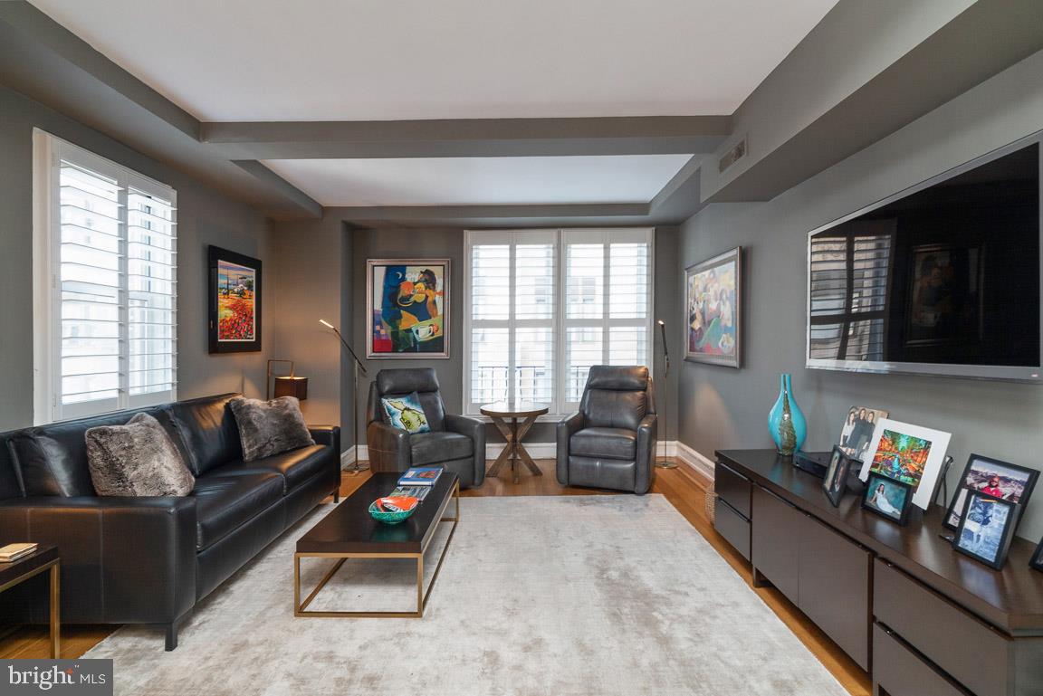 Unique opportunity to live at one of Rittenhouse Square's most coveted buildings, thanks to Unit 14F at The Rittenhouse Plaza! This charming corner 1 bedroom, 1 bathroom flat boasts gorgeous city views, oak wood floors with decorative walnut borders, coffered ceilings, and crown and baseboard moldings throughout most of the home. Enter into a gallery foyer that leads to a beautifully updated chef's kitchen with gray tile floor, calacatta marble countertops, mosaic tile backsplash, wood cabinetry with brass drawer pulls, a Marvel wine cooler and stainless steel appliances, including a Bosch 5 burner range, microwave, dishwasher and refrigerator. There is a separate dining room with a crystal chandelier and ample space for a table with 6+ seats, sitting open to a sun-soaked living room, providing great entertaining space. Perhaps the most luxurious part of the home is the beautifully renovated master bathroom that is appointed in marble with an oversized decorative wood vanity with double sinks and a large glass enclosed shower with a built-in bench. Adjacent, the bedroom is generously sized and features a brand new custom-built closet and walk-in closet. Additional highlights include a laundry room with a stackable washer/dryer and sink, custom paint job throughout and plantation shutters on all windows. One storage space included. Residents of The Rittenhouse Plaza enjoy a 24-hour doorman and concierge, and superb location directly on Rittenhouse Square. Rittenhouse Square is ranked the 6th best neighborhood in North America by Places Rated Almanac. There are 175 restaurants and 199 retailers within a three block radius. The Rittenhouse Plaza is within walking distance to the Market Street office corridor, The Avenue of the Arts and University City. Amtrak 30th Street Station and Philadelphia International Airport are just minutes away.