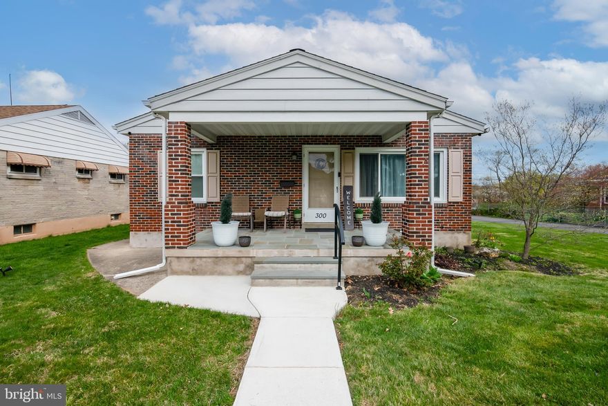 Welcome to this well-maintained 3-bedroom, 2-bathroom ranch home located in the desirable Wilson School District. The main floor features beautiful hardwood floors and a spacious kitchen with stainless steel appliances, a center island with overhang for bar seating, and ample room for cooking and gathering.  All three bedrooms are conveniently located on the main floor, along with a full bath that includes a tub/shower combo, granite countertop, and dual sinks. A second full bath is located on the lower level for added convenience.  The finished basement offers a generous space—perfect for a family room, recreation area, or entertaining—complete with a built-in bar. Outside, enjoy an enclosed breezeway, a rear patio, and an additional carport behind the garage. A large driveway offers off-street parking for multiple vehicles.  This home is equipped with a new electric heat pump, gas hot water backup, and central air. It backs to a peaceful open space owned and maintained by the local fire company, offering extra privacy and a nice backdrop. Conveniently located near major highways, schools, shopping, and dining.