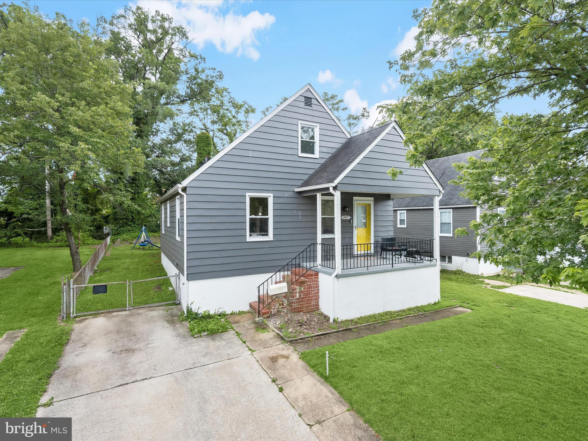 Welcome to this beautifully updated Cape Cod-style home in the sought-after Waltherson community of Baltimore. Arrive through the charming front porch and private driveway into a warm and inviting interior. The main level showcases a neutral color palette, recessed lighting, and rich hardwood floors throughout the spacious living and dining rooms. The gourmet kitchen is a chef’s dream, featuring ceramic tile flooring, a subway tile backsplash, 43” shaker-style cabinetry with soft-close drawers, stainless steel appliances, granite countertops, and a center island with breakfast bar. A stylish bar area flows seamlessly into the four-season sunroom, complete with vaulted ceilings, modern flooring, and walls of windows offering abundant natural light and access to the fenced backyard, ideal for year-round enjoyment. Two generously sized bedrooms and a full hall bath complete the main level. Upstairs, the private primary suite features hardwood floors, double closets, and a spa-like en-suite bath with a walk-in glass shower. The fully finished lower level offers endless possibilities with space for a game room, media room, or guest retreat, complemented by a modern full bath and ample storage. Conveniently located near I-95, US-1, and I-695 for easy commuting. Updates: Renovated in 2020, Roof, Paint, Refinished Flooring, Solar Panels. If using GPS please make sure to select 5407 Pembrook Avenue in Zip Code 21206.