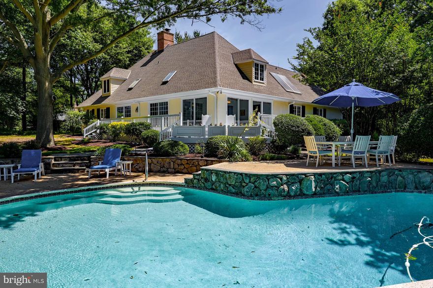 Nestled on a private and elevated 2.36 acre peninsula just minutes to Easton and just a stone's throw from the Talbot Country Club, this beautiful 3864 sq ft home, built in 1979, offers an incomparable living experience on Trippe Creek. Boasting 707 feet of water frontage, the property features a combination of rip-rapped and natural shoreline, a private pier with Magnum boat lift, two slips, and a floating kayak launch - ideal for all water enthusiasts! Enjoy breathtaking water views from many rooms in the house, relax on the wraparound waterside deck, or take a dip in the stunning in-ground pool overlooking the water. The property is graced with a lovely meandering drive, extensive hardscaping, gorgeous mature trees, and attractive landscaping, enhancing its serene and private atmosphere. The home's interior is just as impressive, featuring lovely hardwood flooring throughout and an easy room-to-room flow. With 4 spacious bedrooms and 3.5 baths, there is plenty of room for family and guests! The main level hosts the primary suite, with his and hers dressing areas and an ensuite bath, a formal living room and dining room, gorgeous waterside sunroom, private office/den, fabulous family room featuring a cathedral ceiling with skylights allowing an abundance of natural light, kitchen with center island, and a private side entrance allowing one to access a bar area, mudroom, and laundry facilities. Upstairs find 3 additional sizable bedrooms, a large full bath, and an enormous attic which would allow for easy expansion of the home if desired. There is also a full basement offering great storage space, and included is a wonderful 3-car detached garage as well. This property is the perfect blend of luxury, comfort and tranquility, providing a unique waterfront lifestyle in one of Talbot County's most sought-after locations.