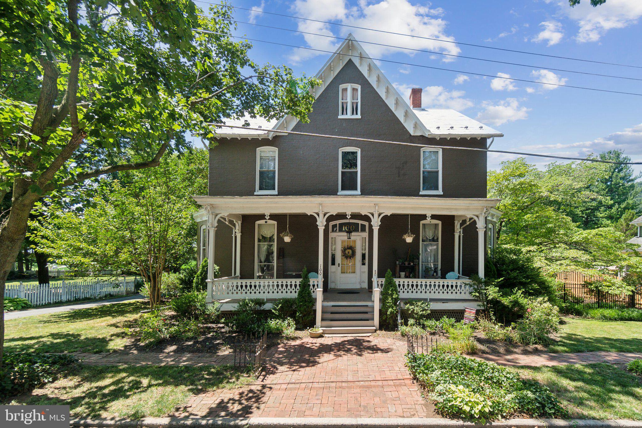 Welcome to the Graham House, an exquisite Victorian-style residence nestled in the picturesque and historic town of Burkittsville. Known for its rich history, Burkittsville provides a scenic backdrop for this enchanting home, which blends Queen Anne, Gothic Revival, and Italianate architectural elements, creating a unique and captivating living experience.
As you approach, you'll be greeted by the breathtaking views of the majestic Appalachian Mountains and the surrounding farmland while just 5 minutes from the MARC Train. The spacious porch and sunroom offer perfect spots to relax and soak in the serene beauty of the countryside. The property, set on over half an acre, features a fully fenced backyard oasis with a living pond and a charming chicken coop. Outdoor storage possibilities are endless, and a separate dwelling unit above the garage, which received a new roof in 2022, adds to the home's versatility.
Step inside and discover a seamless fusion of historical charm and modern comfort. High ceilings, expansive windows, and heart-of-pine hardwood floors enhance the home's inviting ambiance. The main level boasts multiple living areas, including a formal dining room perfect for entertaining. The kitchen is a chef's dream, equipped with new appliances, custom cabinets, and stone countertops, providing ample space for culinary creativity.
On the second floor, three generously sized bedrooms and a bonus room, currently used as a living room, offer plenty of space for relaxation. A balcony on this level overlooks the stunning backyard and mountains, providing a peaceful retreat. The third level features two additional spacious bedrooms and abundant attic space, kept cool and comfortable by dual zone energy-efficient HVAC systems and a heat pump installed in 2023.
Other recent upgrades enhance the home's appeal and functionality, including a new well pump and pressure tank, a new main electric panel, and a resealed metal roof in 2021. The front porch stairs have been updated, and the home has a 4-stage water filtration system with a water softener. Additional updates include a new septic tank fitting and a new fence in 2022.
Experience the perfect blend of historical elegance and modern luxury at the Graham House. With its scenic views, extensive outdoor space, and thoughtfully updated interiors, this home is a rare find in the heart of Burkittsville. Don’t miss the opportunity to make this enchanting Victorian masterpiece your own. Schedule your private tour today and step into the timeless beauty of the Graham House.
