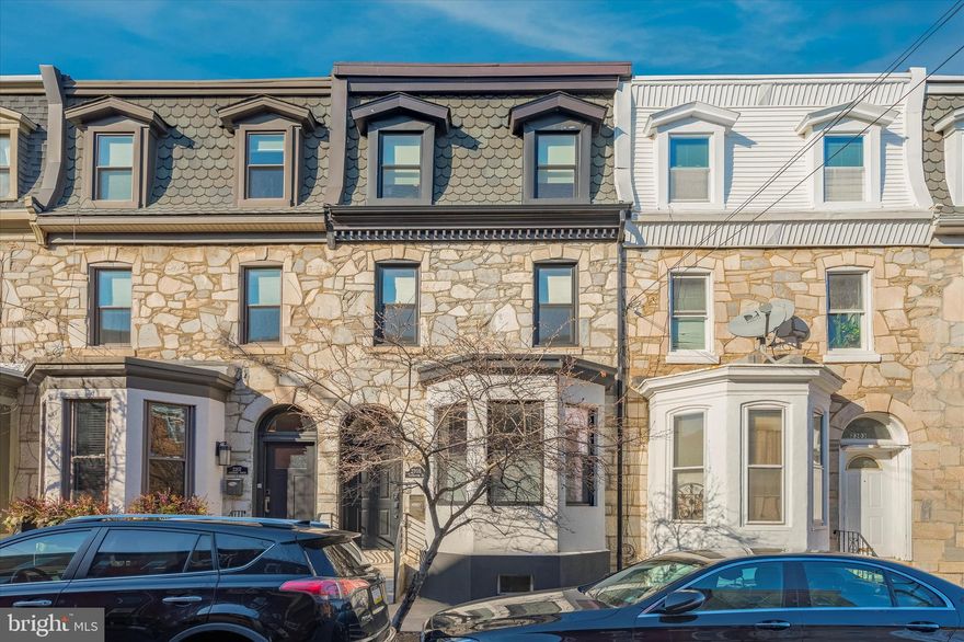 Welcome to 2305 Catharine, a one-of-a-kind masterpiece in the heart of Graduate Hospital! This truly concession-free home consists of 3 bedrooms (+ DEN), 2.5 bathrooms, PRIVATE GATED PARKING IN REAR (no compromised layout here!), first floor powder, finished basement with tons of storage, and two-tiered ROOF DECK with unobstructed views and was fully renovated in 2016 (3 years left on tax abatement)! This oversized lot (16x62) makes for expansive rooms throughout including a wide open first floor plan full of natural light and is full of custom details including gorgeous wide plank hardwood floors throughout, oversized trim, custom tile baths, high ceilings, and large windows. Entertainer's kitchen consists of an enormous Carrera marble island, Wolf oven, new shaker style cabinets and pantry, built-in microwave, deep sink and huge french door refrigerator! All ceilings 9-10 ft high! The perfectly laid out second floor has two large bedrooms with great closets and a beautifully redone hall bath with tub! Head up to the owners suite to find your dream come true - a huge bedroom with high ceilings, tons of light (+ skyline views), a beautiful bathroom with custom tile throughout and double vanity, and right down the hall from the den with laundry and more storage to use as you wish! The finished basement and roof deck complete the home for more indoor and outdoor recreational space! Walk anywhere from here within minutes including Rittenhouse Square, Fitler Square, Schuylkill River Park and Trail, all of the top restaurants and shopping, Penn, Drexel, and more! Additional features include: professionally wired for AV, wifi access points, video intercom system, security system, tankless hot water heater, new custom first floor blinds, new custom closet systems, dual zoned HVAC, water purification system installed, basement utility sink and more!