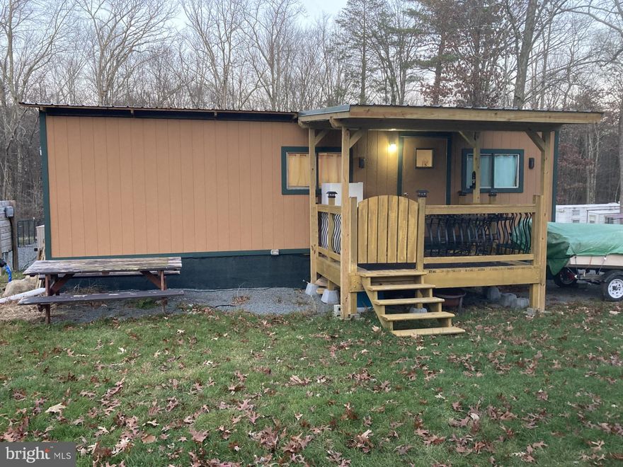 This is your chance to own your own home near Lake Wallenpaupack!  Enjoy boating, hiking, fishing and many extras.  This privately gated community is located in Big Bear and is NOT ON LEASED LAND.  Located within two miles to the public boat launch on Lake Wallenpaupack.  Situated on the largest lots in community. This home comes completing furnished, included two sheds, picnic table, heated hose and heated hydrant for winter camping.  There is enough room on the lot to park your boat.  Built in 2021 this home sleeps 4, and has
a new metal roof.  Amenities in community are outdoor pool, horseshoe pits, fire pits and many more.  This is also a great rental through air bb.  Move right on in with this fully furnished home and enjoy Lake Life!