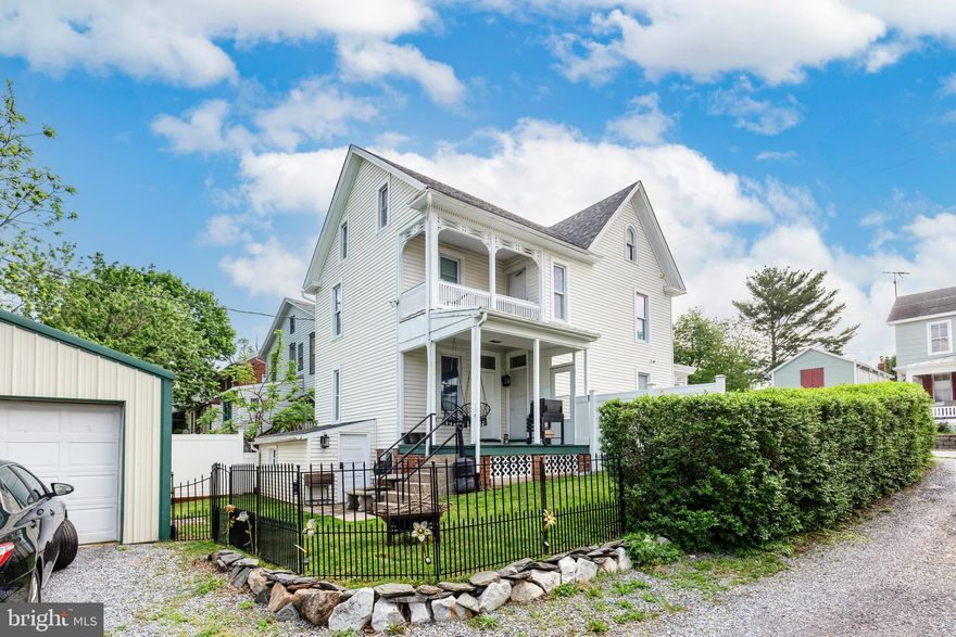 Historic charm meets modern convenience in this 3 bedroom 2.5 bath home that has been painstakingly refinished. The modern kitchen has everything you need to make it the center of  your home, with  updated counters and appliances.  The original wide plank hardwood floors, incredible woodwork, half bath and 9' ceilings round out the main floor.  Large two car insulated garage/workshop out back.  Both bathrooms have been lovingly updated with modern conviences, including a jetted tub and beautiful tilework.   All systems have been updated, basement finished with a full bathroom and kitchenette and this home is ready to be loved for the next 100 years.  New roof 2024 and whole house water filter and water softener. 100% no money down financing eligible!