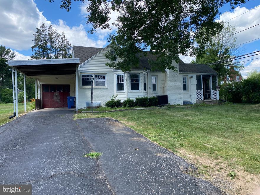 OPPORTUNITY awaits at this brick cottage style ranch home in Riverview Park! This 3 bedroom, 2 full bathroom home has been a rental for a bit but is ready for someone to love it as their own again. Nice layout with the kitchen right off the carport side entry and windows across the front where the kitchen and dining room are located. The kitchen has a brand new wall oven as the old one didn't work and the owner left a brand new garbage disposal that needs to be installed. The dishwasher also does not work. The living room is on the right side of the home. The fireplaces have not been used in a long time so please always get an inspection before using. Off the living room is a covered patio that holds so much potential to be a private, cozy spot to  spend time outdoors. There are 2 bedrooms on the main level with a full bathroom between. The upper level has a large bedroom and full bathroom. It would make a nice primary suite. The carpet was just removed on the upper level and the oak flooring will refinish beautifully. We believe there is hardwood flooring beneath the rolled vinyl flooring on the main level as well. The lower level has a family room, workshop, utility space and laundry. The lot is a nice level rectangular and there is a shed in the rear. Ample parking with room for 3-4 vehicles in the driveway, the carport and a one car garage. Great location in the park and easy to show!