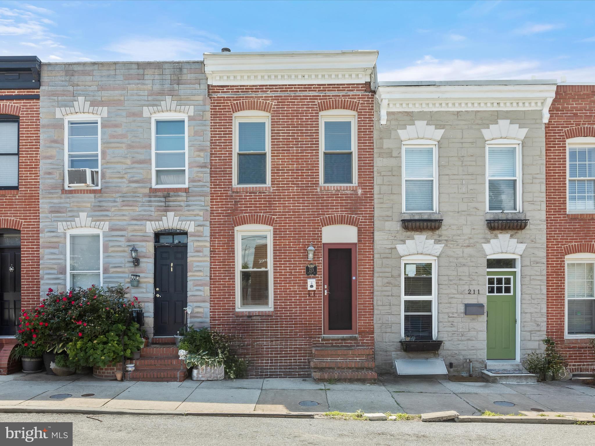 Welcome to this 2-bedroom, 2.5-bath brick rowhome in the Riverside Park community, offering convenient access to nearby parks, shops, and restaurants. The main level features rich hardwood floors and a freshly painted neutral color palette, with an open layout connecting the sunny living room, casual dining area, and kitchen. Exposed brick adds character, and the kitchen includes stainless steel appliances, granite counters, gas cooking, and a subway tile backsplash. The half bath with a convenient laundry area, alcove and a walkout to a fenced rear patio completes this level. Upstairs, you'll find two bedrooms, including a primary suite with an en suite bath and access to a rooftop deck with city views. A second full bath with a soaking tub serves the additional bedroom. Steps away from the Ella Bailey Recreation Center and with easy access to I-95, this home offers a practical option in a convenient city location.