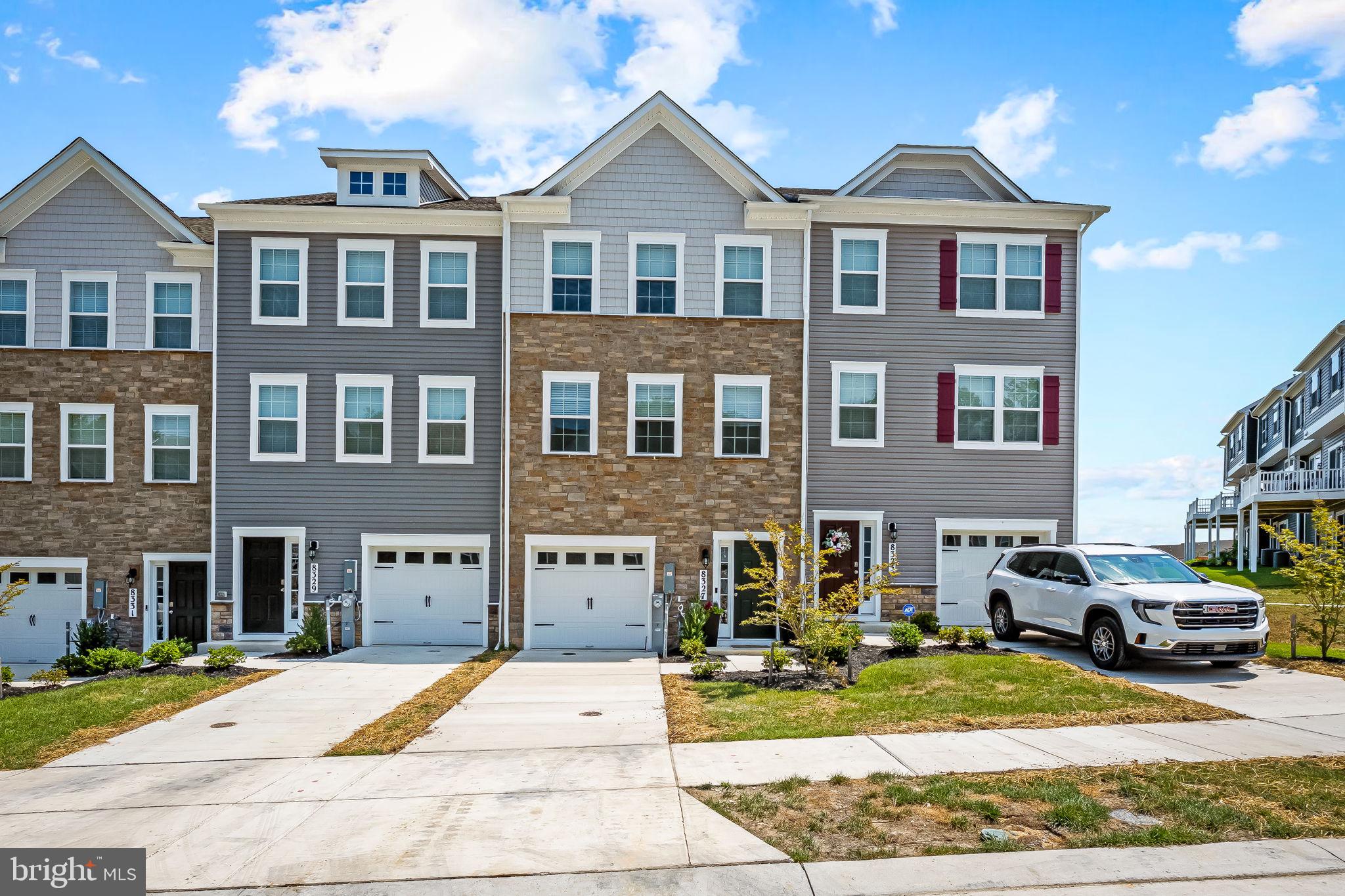 Don’t miss this impeccably maintained, model‑like three-level townhome by D.R, Horton (2024). A striking blend of modern design and practical charm in a prime location. The home boasts four bedrooms, three full bathrooms, a thoughtfully placed half bath, and a one‑car garage with additional one-car driveway. On the main level, you'll find a bright in‑law suite or family room with a full bath and walk‑out access—perfect for a potential patio overlooking the tot lot. Upstairs, natural light and cross‑breezes fill the open living area, where a stunning kitchen highlights stainless steel appliances, a generous granite-topped island, and ample prep space—all flowing seamlessly into the living room and out onto a deck offering front‑row views of the playground and recreational area. The upper level also houses three additional bedrooms, convenient laundry just steps from the closet, and a serene primary suite featuring abundant natural light, an enviable walk‑in closet, and a spacious, spa‑like bathroom. Lovingly cared for by its current owner, every detail of this home reflects meticulous upkeep and presents just like a showcase—ready for its next owner to move right in.