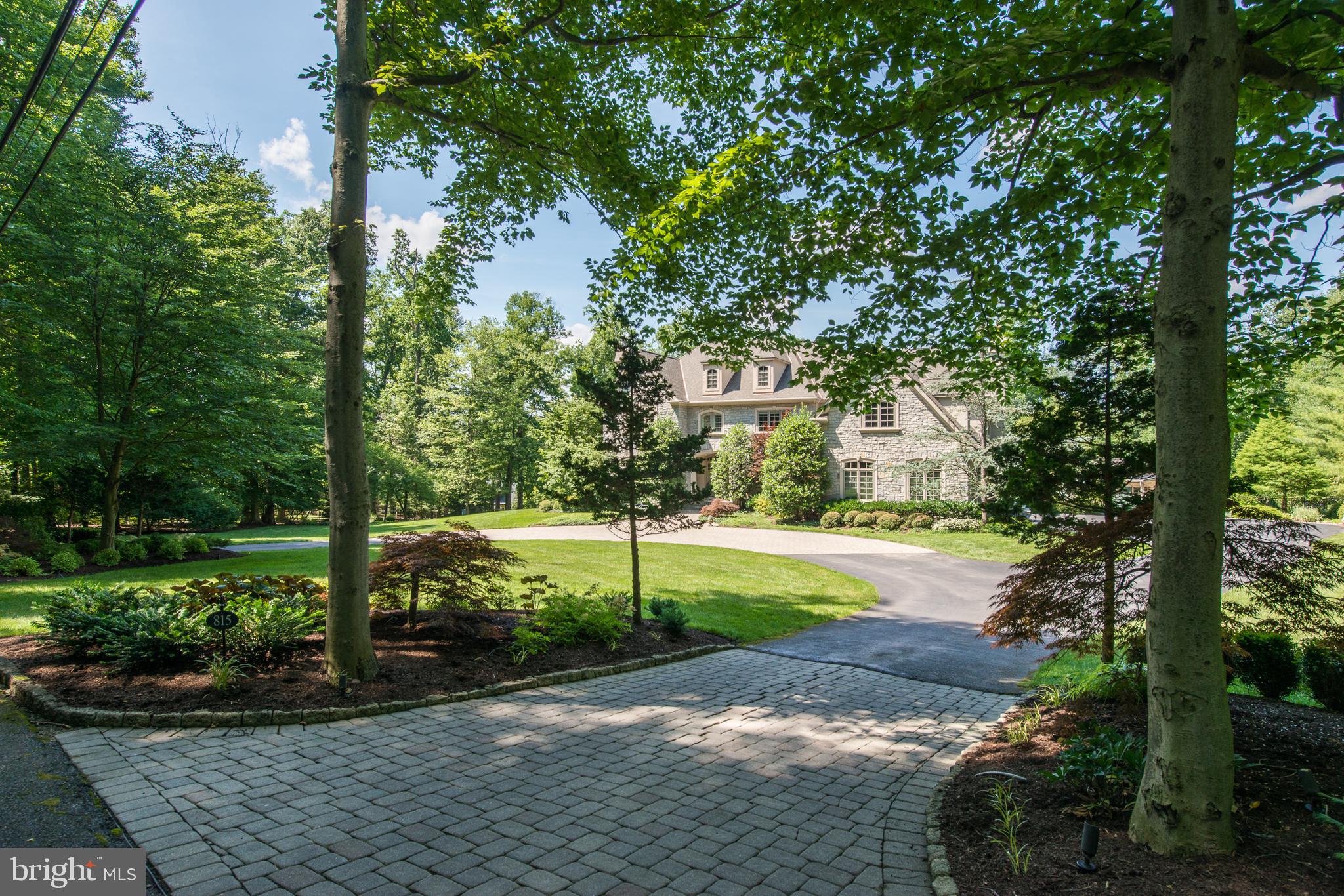 Welcome to 815 Brushtown Road, a truly amazing and exquisite custom built Philomeno and Salamone stone colonial family home. Beautifully situated on a bucolic park like setting on over 2 acres located on a private lane in coveted Lower Gwynedd.This stunning home offers a masterful design with modern luxury that is uniquely embodied in this meticulously maintained home that offers 5 bedrooms with 5 en suite baths. Magnificent private grounds include a circular driveway, in ground pool and a luxurious pool house, gorgeous landscaping and hardscaping and a three car garage..you will not be disappointed! Gleaming hardwood floors, with gorgeous mill work throughout greet you as you enter into this gracious center hall colonial. A spacious vestibule offers an elegant formal sunlit living room with gas fireplace; to the left is a perfect sized formal dining room with custom window seating. The luxurious new gourmet chef's kitchen includes top of the line cabinetry, sub zero and wolf appliances, a beautiful sleek copper hood, one of a kind gorgeous basket weave back splash, and a large island for all of your cooking and entertaining needs! Off of the kitchen is a beautiful breakfast room, with soaring ceilings and entrances to the back decks, this will be your favorite morning place to sit and have coffee.The impressive sun lit family room is lined with a wall of windows, with a limestone fireplace and coiffured ceiling..truly a beautiful room!. You will also find a guest room with en suite bath on this floor, two powder rooms, a mudroom and two entrances to the walk out lower level. Upstairs you will find a magnificent spacious master suite with two custom closets, stunning master bath with champagne tub, marble heated flooring, steam shower, a private water closet and double sinks, this is a dream master suite! You will find four more beautifully designed and spacious bedrooms all with en suite baths and custom closets on the upper floor along with a perfect sized laundry room.Lower level offers a home gym with a great office/craft room and a full bath with plenty of space to entertain as well. The outdoor space offers a wraparound porch, decking to eat outdoors and amazing in ground pool along with the luxurious pool house which offers gorgeous tiled heated floors, kitchen with granite counter tops, SS appliances, dressing room, laundry room and full bath with cathedral ceilings and is a relaxing at home get-a-way! Entertain family and friends in this private resort like outdoor space. Not one detail has been missed on this magnificent home which shows like an architectural digest home.Stucco has been tested twice, reports available..no issues found.