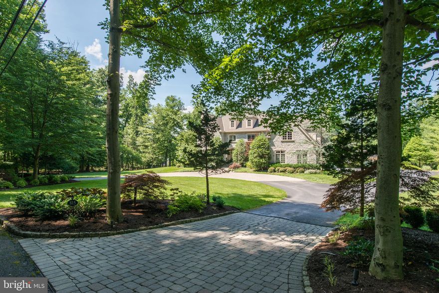 Welcome to 815 Brushtown Road, a truly amazing and exquisite custom built Philomeno and Salamone stone colonial family home. Beautifully situated on a bucolic park like setting on over 2 acres located on a private lane in coveted Lower Gwynedd.This stunning home offers a masterful design with  modern luxury that is uniquely embodied in this meticulously maintained home that offers 5 bedrooms with 5 en suite baths. Magnificent private grounds include a circular driveway, in ground pool and a luxurious pool house, gorgeous landscaping and hardscaping  and a three car garage..you will not be disappointed! Gleaming hardwood floors, with gorgeous mill work throughout greet you as you enter into this gracious center hall colonial.   A spacious vestibule offers an elegant formal sunlit living room with gas fireplace; to the left is a perfect sized formal  dining room with custom window seating.  The luxurious new gourmet chef's kitchen includes top of the line cabinetry, sub zero and wolf appliances, a beautiful sleek copper hood, one of a kind gorgeous basket weave back splash, and a large island for all of your cooking and entertaining needs! Off of the kitchen is a beautiful breakfast room, with soaring ceilings and entrances to the back decks, this will be your favorite morning place to sit and have coffee.The impressive sun lit family room is lined with a wall of windows, with a limestone fireplace and coiffured ceiling..truly a beautiful room!. You will also find a guest room with en suite bath on this floor, two powder rooms, a mudroom and two entrances to the walk out lower level. Upstairs you will find a magnificent spacious master suite with two custom closets,  stunning master bath with champagne tub, marble heated flooring, steam shower, a private water closet and double sinks, this is a dream master suite!  You will find four more beautifully designed and spacious bedrooms all with en suite baths and custom closets on the upper floor along with a  perfect sized laundry room.Lower level offers a home gym with a great office/craft room and a full bath with plenty of space to entertain as well. The outdoor space offers a wraparound porch, decking to eat outdoors and amazing in ground pool along with the luxurious pool house which offers gorgeous tiled heated floors,  kitchen with granite counter tops, SS appliances, dressing room, laundry room and full bath with cathedral ceilings and is a relaxing at home get-a-way! Entertain family and friends in this private resort like outdoor space. Not one detail has been missed on this magnificent home which shows like an architectural digest home.Stucco has been tested twice, reports available..no issues found.