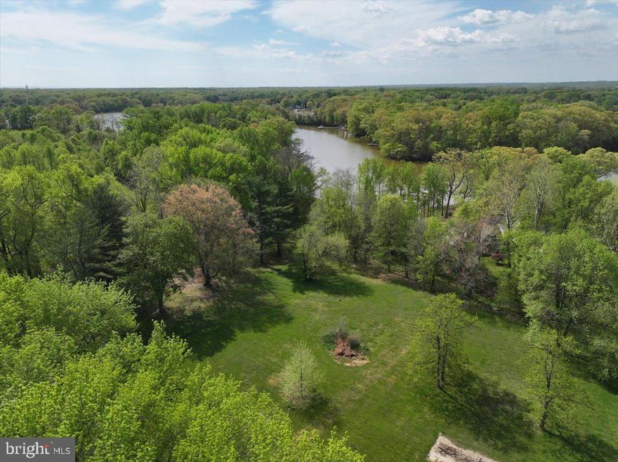 Pristine Waterfront Canvas: 2.82 Buildable Acres on Smith Creek.
Rare opportunity to acquire a completely vacant, buildable waterfront lot which is ready for permit in the heart of West River. The legwork has already been done - the permit process is almost complete, just pending the Buffer Management Bond.   Previously approved plans for a 5000+ sq.ft home are avaliable for purchase,  or design your own  homestead on this sprawling 2.82-acre parcel which offers the perfect blend of wooded privacy and 80 feet of premium water frontage on Smith Creek. Skip the headache of demolition or renovation, this is a clean slate ready for your custom architectural masterpiece.  Direct navigable access to the West River and Chesapeake Bay makes this a boater’s dream.  Escape the city to your own private sanctuary just 15 minutes from Annapolis, around the corner from Galesville, and an easy commute to DC and Baltimore. Boat to several waterfront restaurants & marinas located a quick ride away.