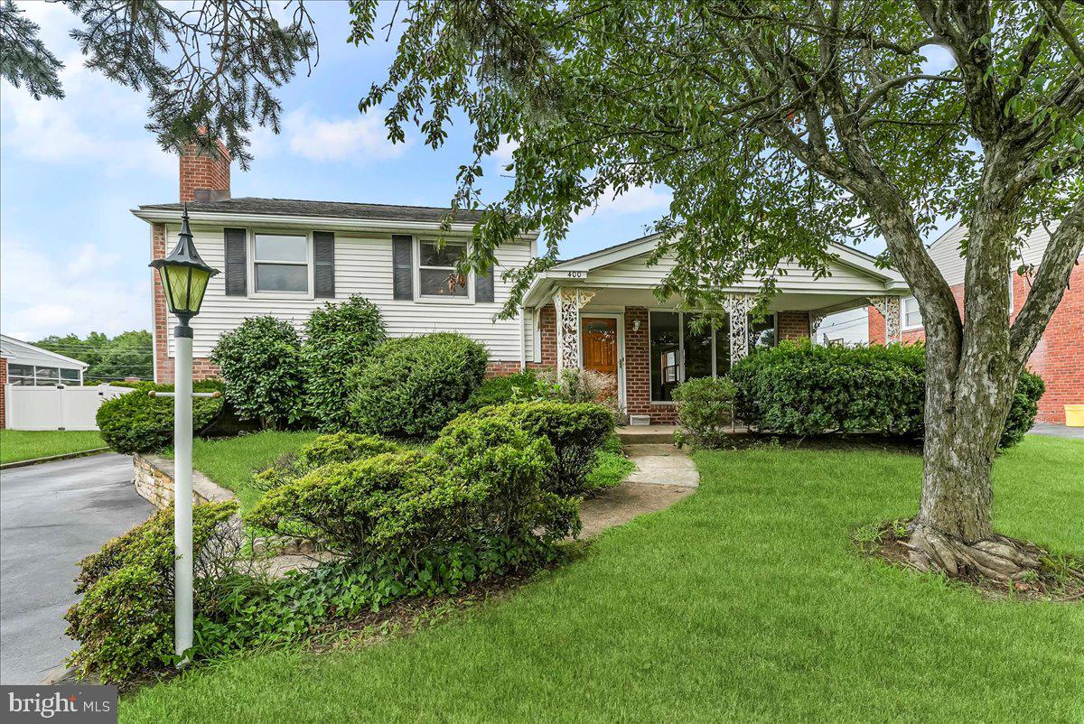 Step into this charming detached split-level home, nestled in the highly sought-after Dream Valley neighborhood of Springfield, within the award winning Springfield School District. This well-appointed home features 3 bedrooms, and 2 full baths with approximately 1990 square footage of living space. The inviting covered front porch greets you upon entering the front door. The main floor's open floor plan effortlessly connects the living room to the dining and kitchen areas complete with refrigerator, electric stove, built-in microwave, dishwasher, washer, dryer, central air, gas heat and hot water. Elegant ceramic flooring and large bay window providing an abundance of natural sunlight. The upper level boasts a spacious primary bedroom, 2 additional bedrooms, linen closet, full bathroom and hallway access to attic providing extra storage space . All bedrooms have beautiful hardwood flooring. The lower level features another outstanding living space, complete with wood burning fireplace, ceramic flooring and large laundry room, full bathroom. and separate outdoor entrance. The large private driveway can easily accommodate up to 4 cars and leads to large partially fenced in back yard. Please note that the detached garage in the back is NOT part of the rental. This beautiful home is conveniently located to many shopping and restaurant districts.