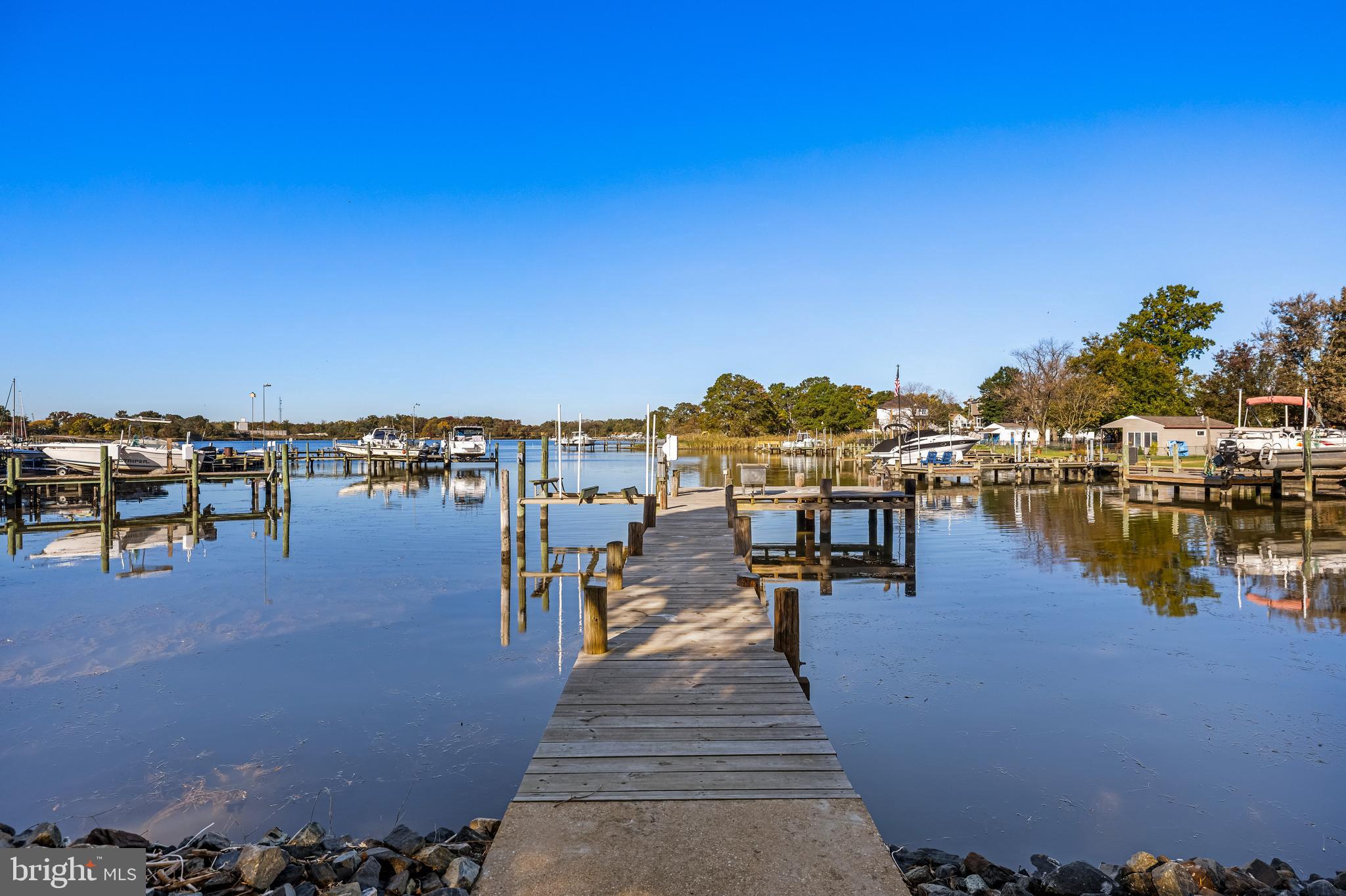 WATER FRONT! WATER FRONT! WATER FRONT! Welcome to your dream home newly constructed in 2004! This magnificent home is situated on a rare corner lot with 250 ft of water frontage off scenic Jones Creek. This beautiful property is designed for waterfront living, complete with an L-shaped pier WITH BOAT LIFT featuring electric and water hookups. This home sits on a large fenced flat yard with lush landscaping surrounding. According to seller rip rap and back fill added 10 ft extension onto property along waters edge.
The oversized 2-car garage offers massive workspace, wood-burning stove, and a convenient half bath. 2 bays on the driveway and another garage door on the opposite side for boat or tractor storage. This home was built well with 2x6's and abundant insulation, sitting high for beautiful views and to never take on water. Enter thru the garage or the lovely front porch to a spacious open floor plan featuring a living room with scenic views out every window. This open space encompasses a dining room and eat-in kitchen with seated island. Propane tank allows for gas cooking and the double ovens are electric as any baker would demand. There is abundant storage in 2 pantries and main level laundry room for convenience.
The main level includes two large bedrooms and a full hall bath. The primary suite is a true retreat. Wake up to breathtaking water views and enjoy an en-suite bath complete with double sinks, a soaking tub, separate stand-up shower and spacious walk in closet.
Upstairs, let your imagination soar with a spacious bonus area—perfect for multiple bedrooms and baths or a recreation room, or maybe a second primary suite.
This home is exceptionally insulated for comfort and features Anderson windows, a 2022 AC system, and thoughtful storage spaces under the front stairs and in the shed. Surrounded by mature trees, this property offers privacy, tranquility, and endless opportunities for waterfront living.
Don't miss out on this rare opportunity to own a piece of paradise on Jones Creek!